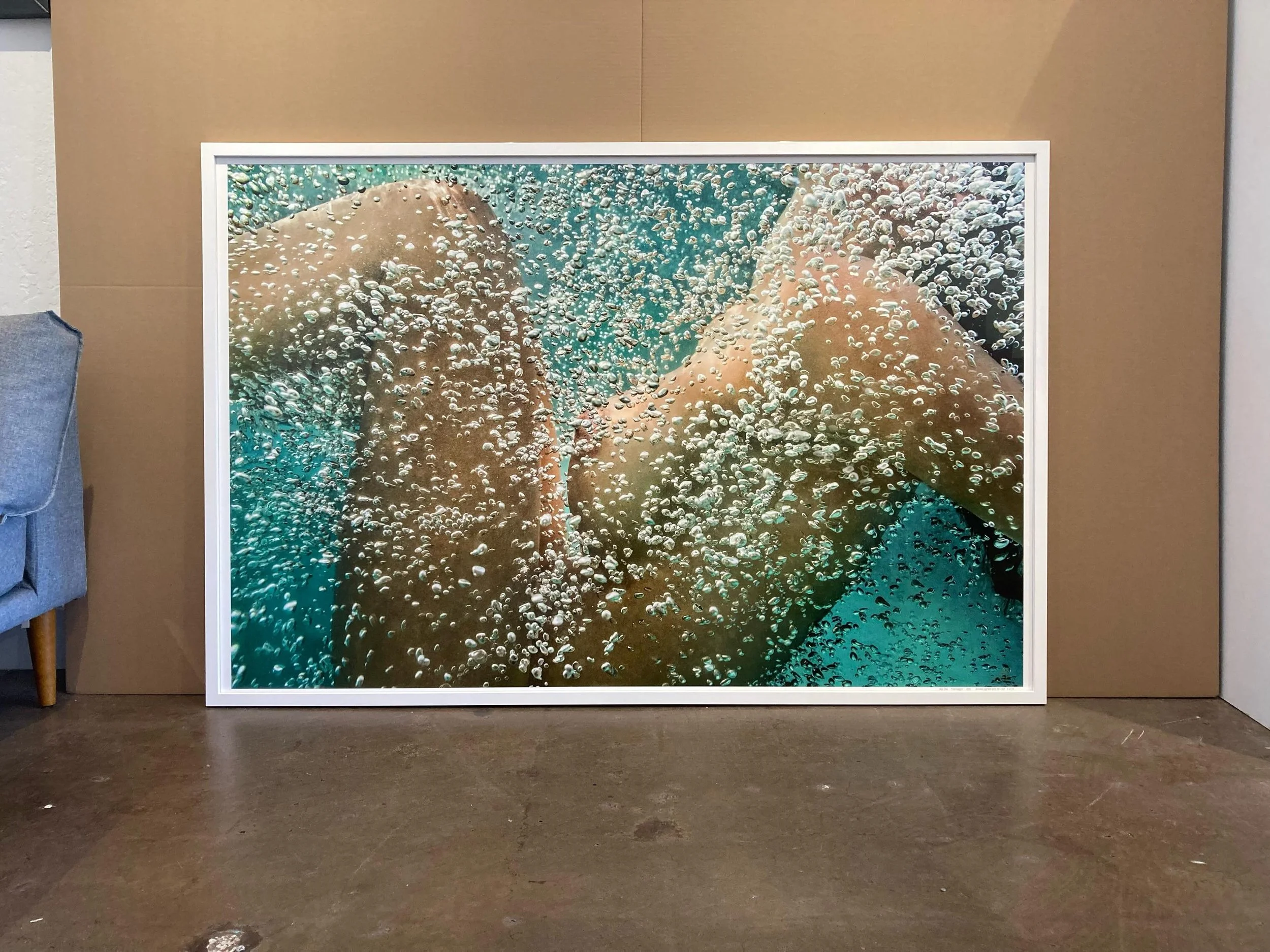 Sometimes you just want a smaller frame on a larger piece.  This larger, beautiful nude photo was framed in a slimmer white lacquer frame from Larson Juhl.  As long as the frame has enough depth, you can use slim frames on larger pieces.  We build an