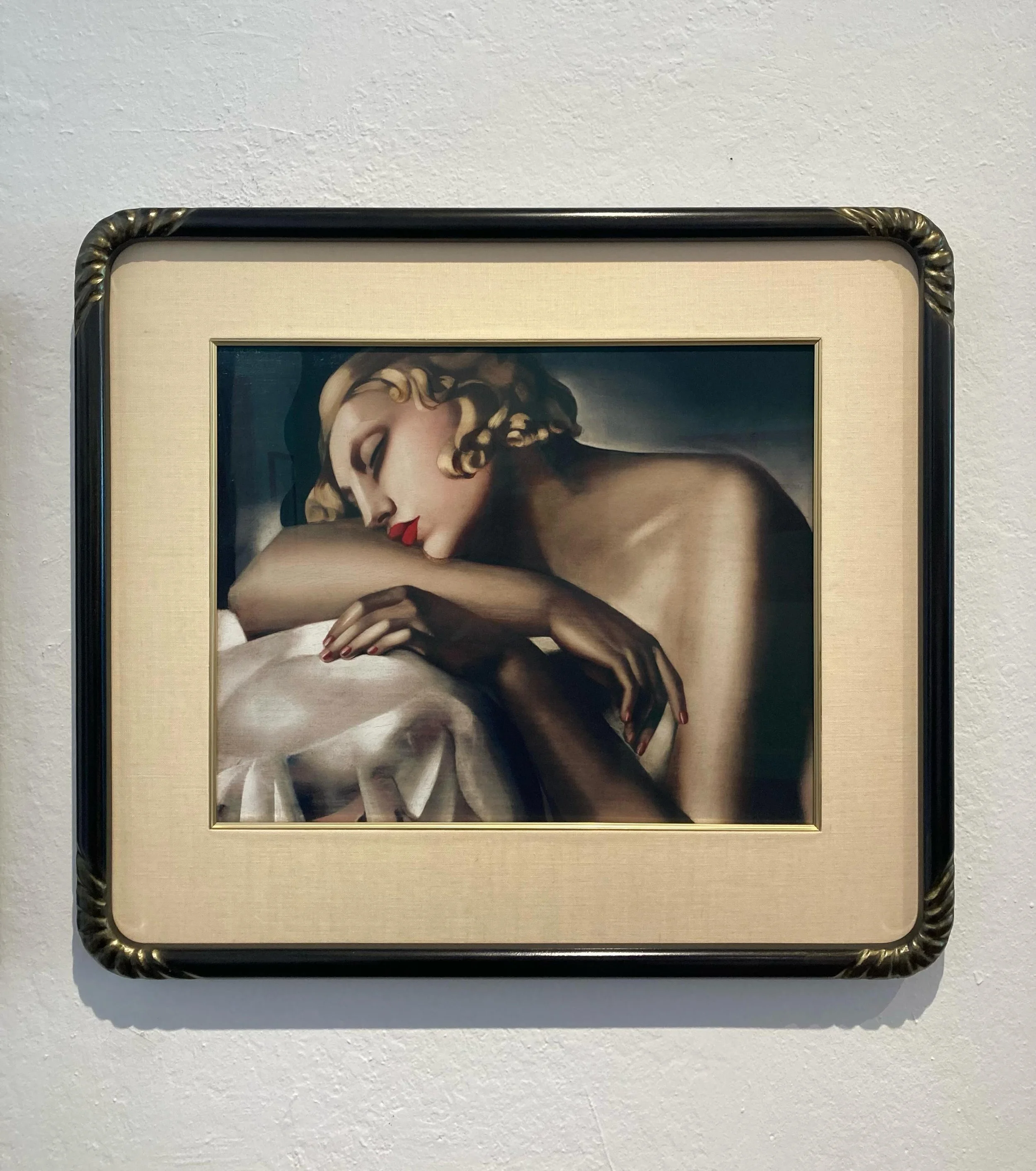 The beautiful Tamara de Lempicka print was framed in a shiny gold leaf frame that distracted from the art.  We came up with this art deco design that was then made by Daedalian.  We went for a soft black finish with a slight sheen and a curvy detail 