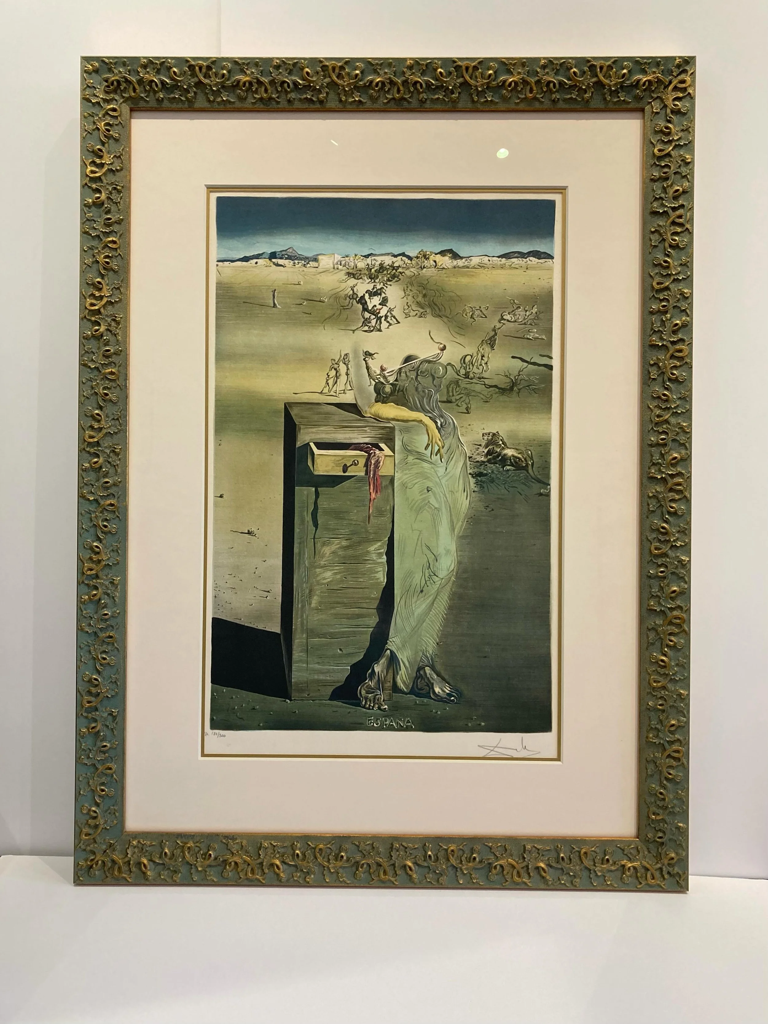 Sometimes you find the perfect frame!  The pattern and color of this Bella frame from the Jardin line, complements this Dali lithograph perfectly.  It felt like it was made for this piece.
#framecraftersgallery #bellamoulding #daliart #dalilithograph