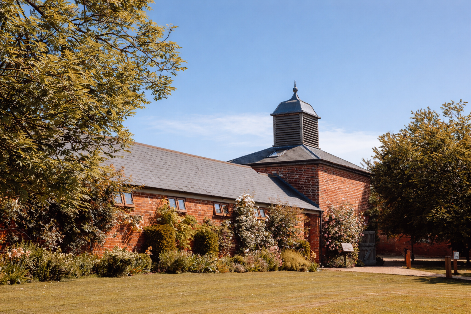 Charming brick building with cupola.png