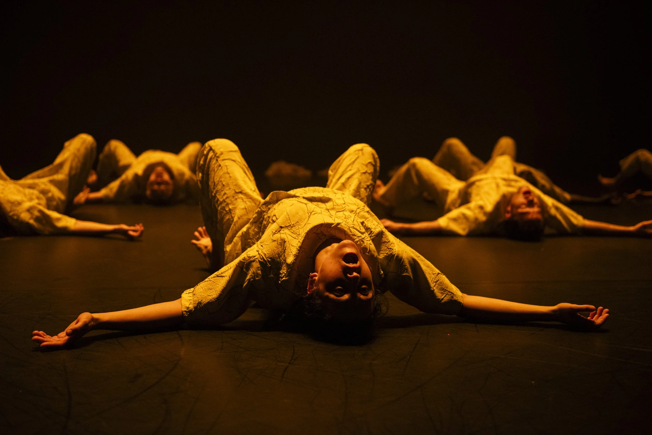 Dancers from the Fifth Sun by Luail, on the floor with arched backs