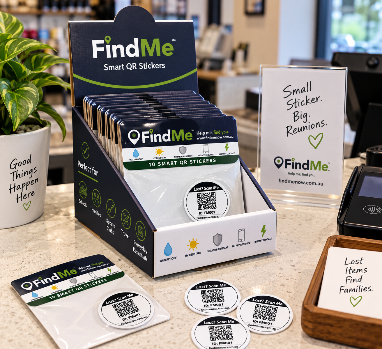 FindMe smart QR sticker packs displayed on a retail counter.