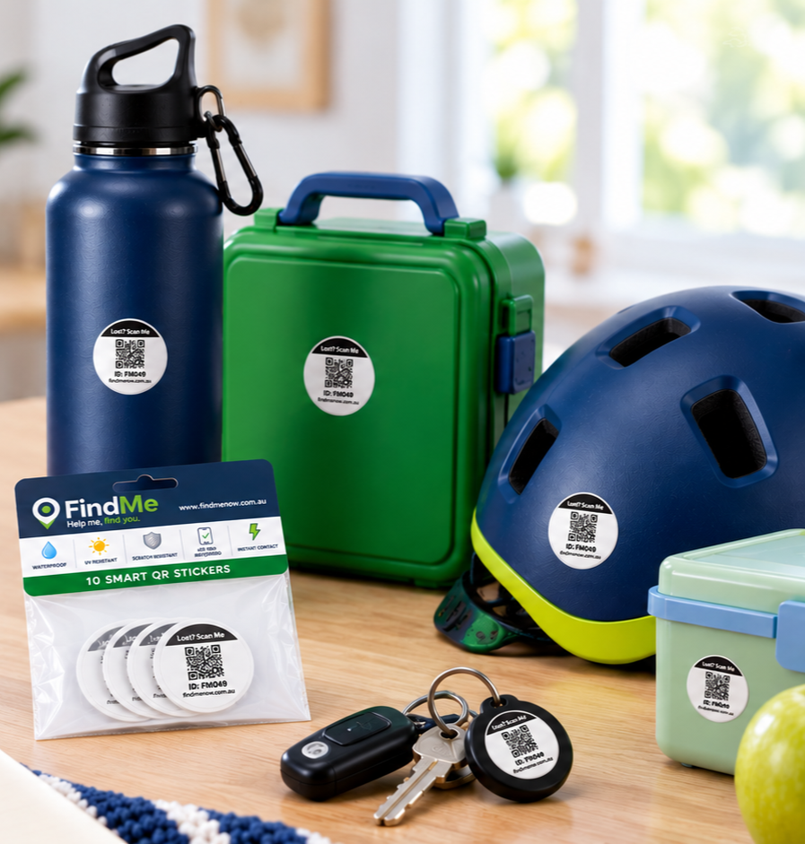 FindMe QR sticker pack with a drink bottle, lunchbox, helmet and keys on a desk.