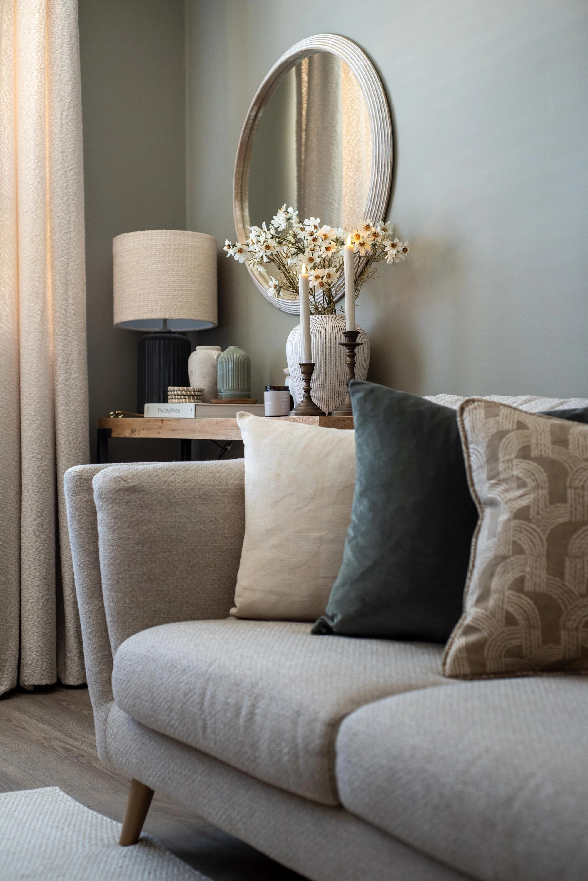 Cosy Living Room in Devon with Neutral Linen Sofa and Styled Console Table with Round Mirror