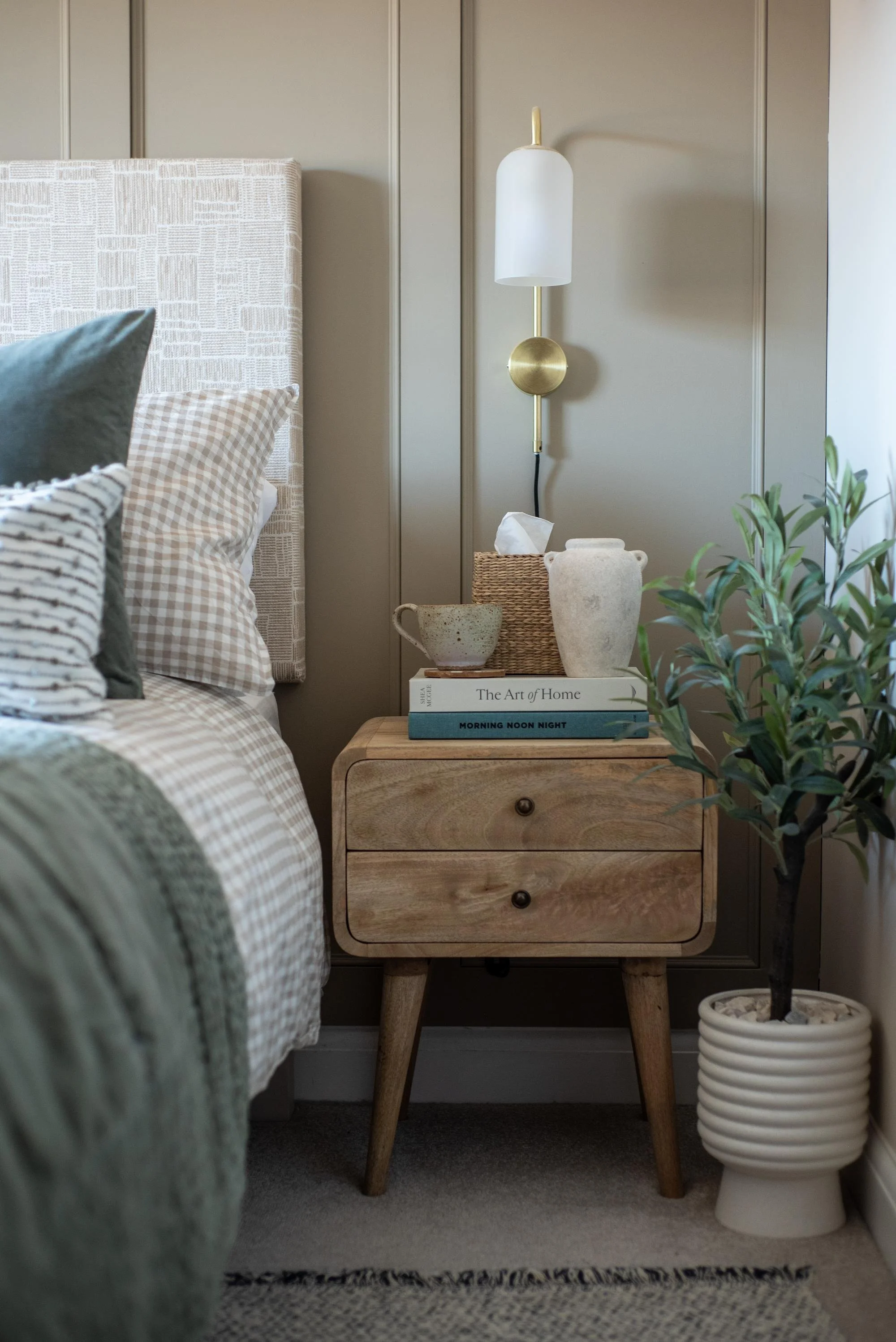 Devon Master Bedroom with mid-century wooden bedside table and traditional panelling.