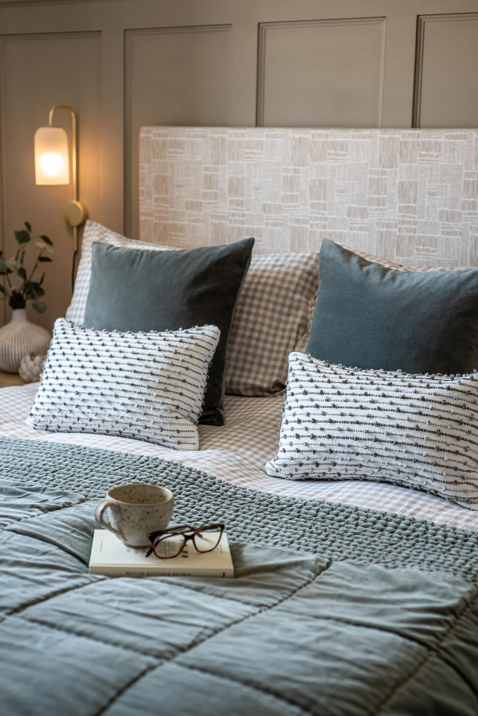 Devon Master Bedroom with Quilted Velvet Bedspread, Textural Scatter Cushions and Ambient Wall Lights