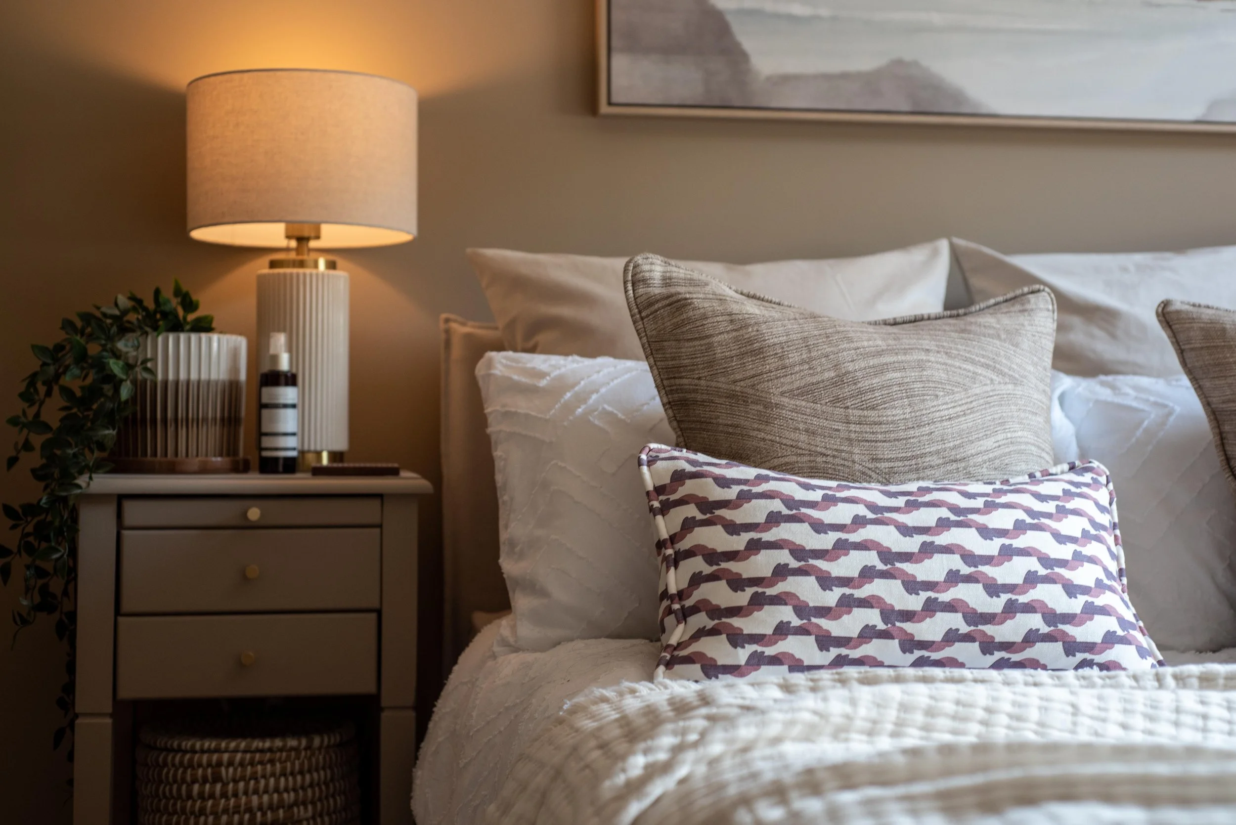 Ribbed table lamp and simple taupe bedside table.