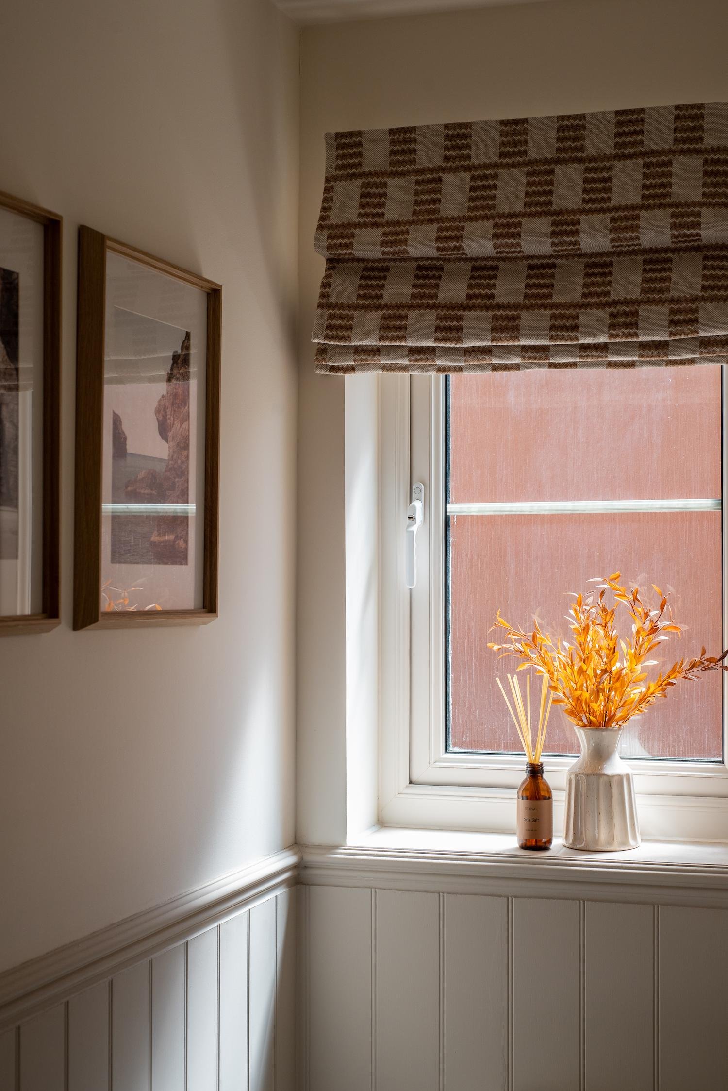 Statement Roman Blind with classic tongue and groove panelling in this Cornish En-Suite.
