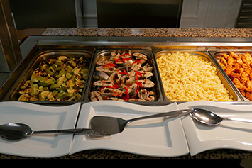 Food in trays for camp catering
