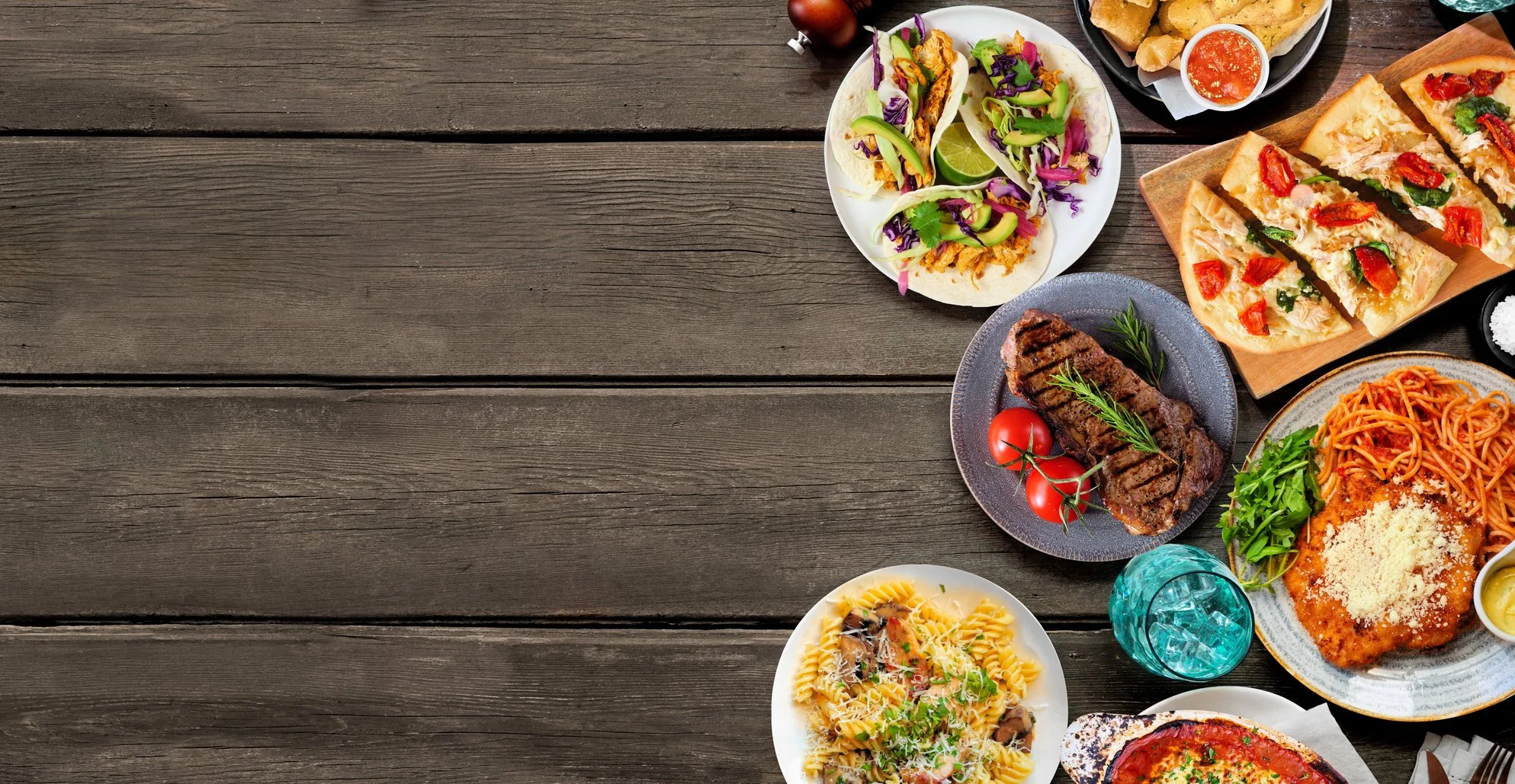 Foods served on plates, steak salad, pizza