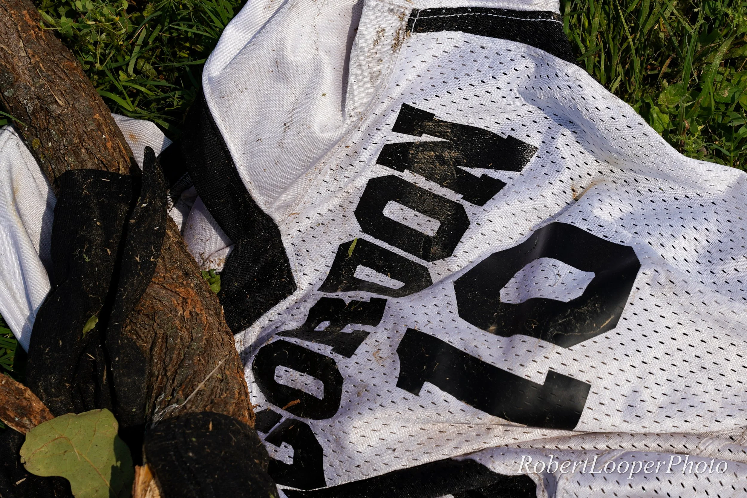 A Gordon High School football jersey lies tangled in the grass after having been thrown by an EF-1 tornado that hit Gordon, Texas the night before May, 19, 2025. The tornado caused significant damage to residential structures in the area, as well