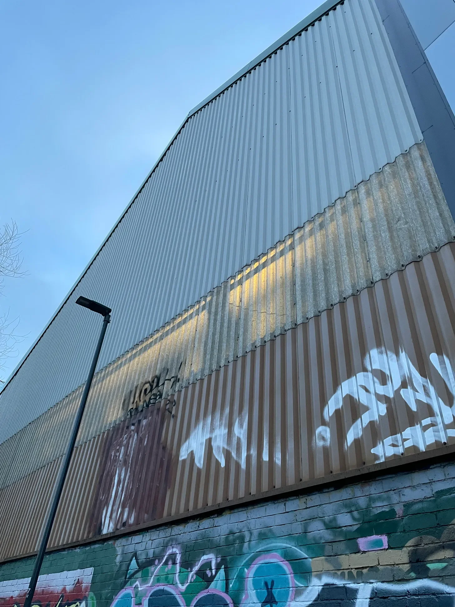 Graffiti on an industrial-looking wall.
