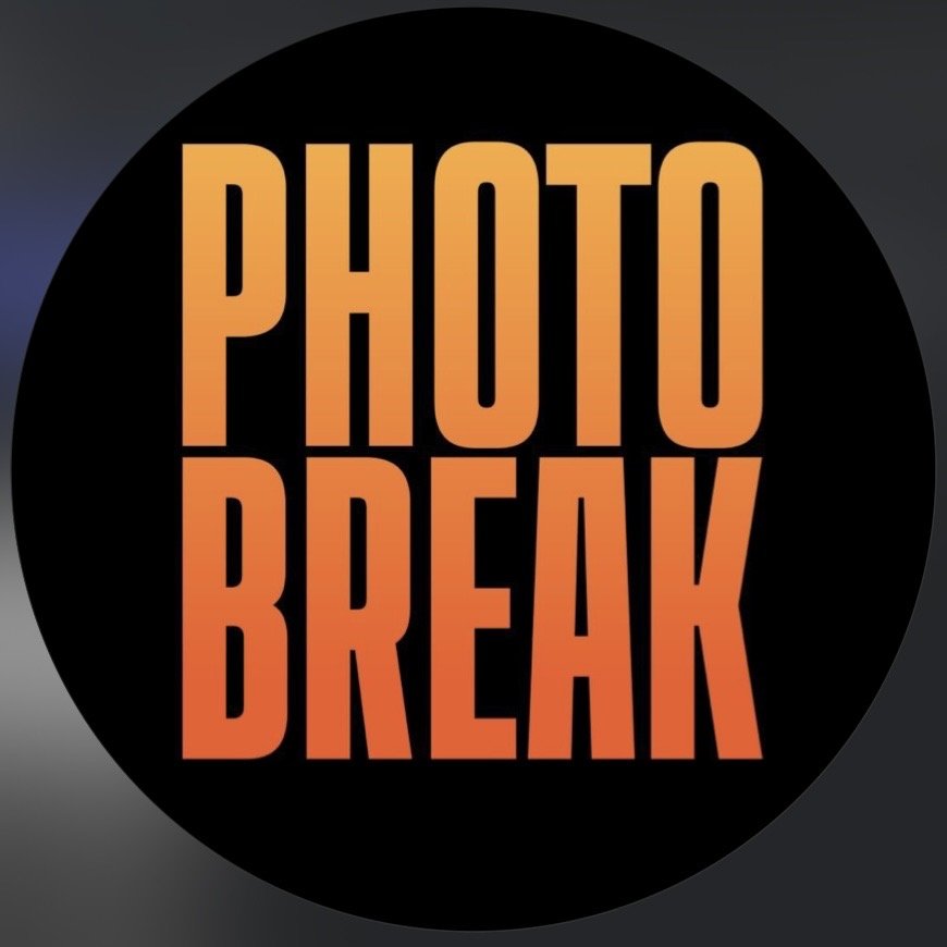 Text reads "Photo Break" in orange font on a black circular background.
