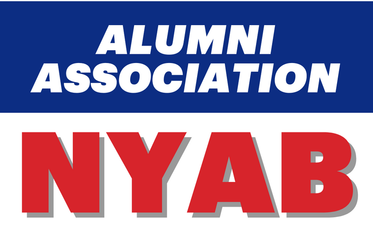 A sign with a blue top section reading 'ALUMNI ASSOCIATION' in white text, and a white bottom section with red text saying 'NYAB' with a gray shadow.