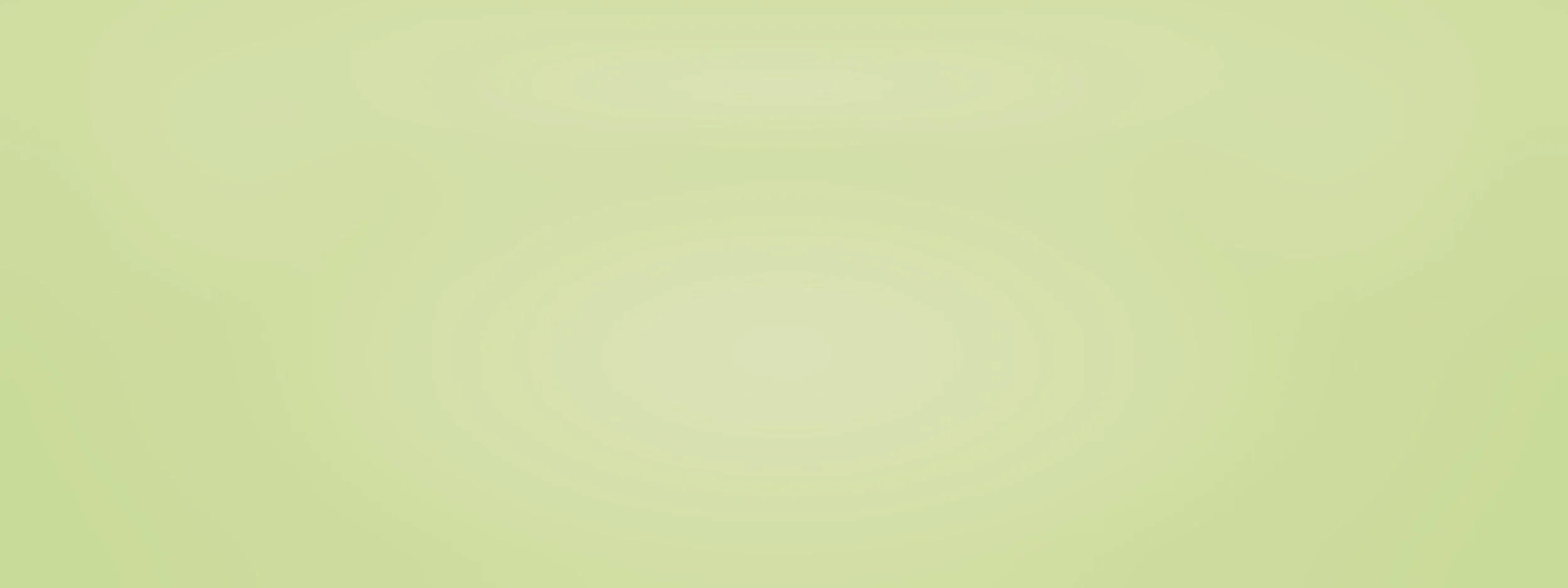 A plain light green background.