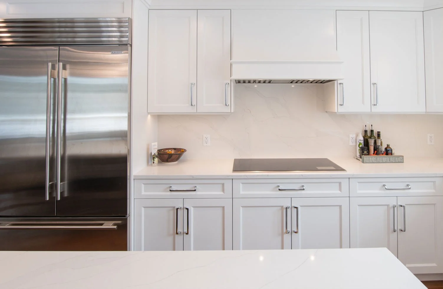 White kitchen remodel with gas stove