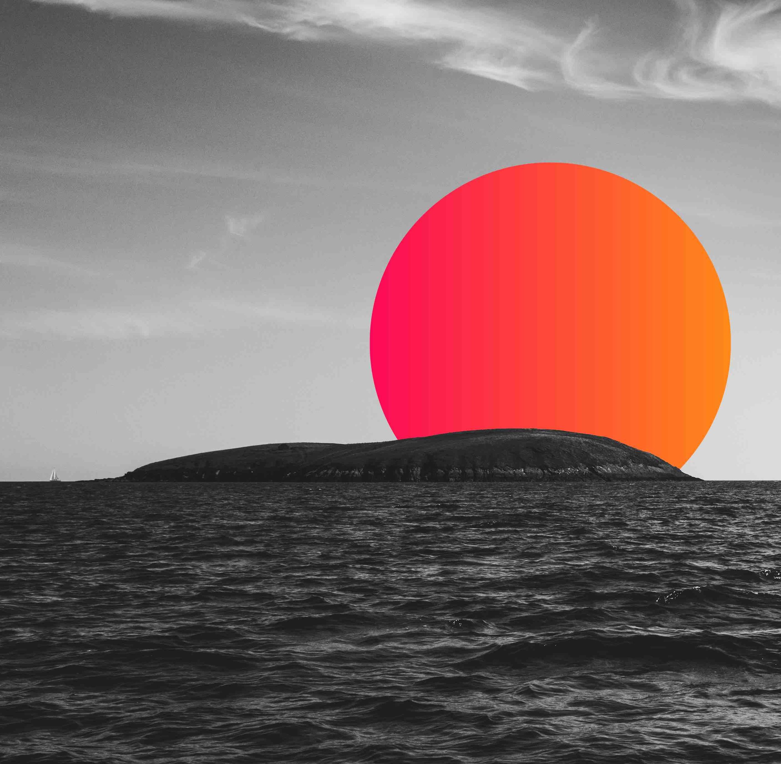 Monochrome ocean scene with an island and digitally added bright sunset.