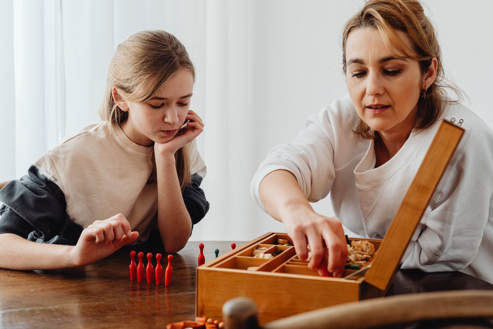 Parent teaching a child empathy and kindness by example