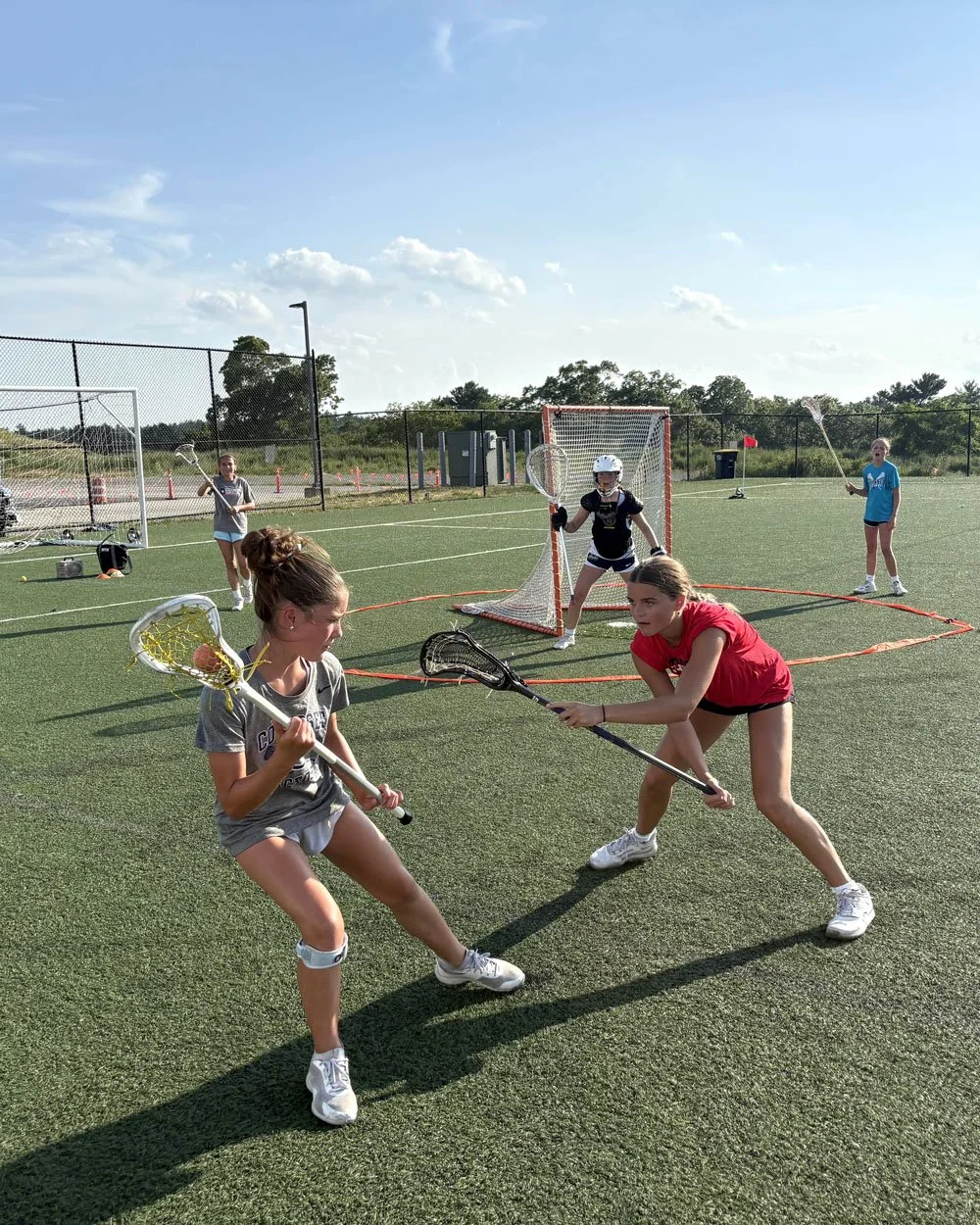 Girls youth lacrosse training — offensive vs. defensive footwork drill at Big Rock Lacrosse camp.jpg