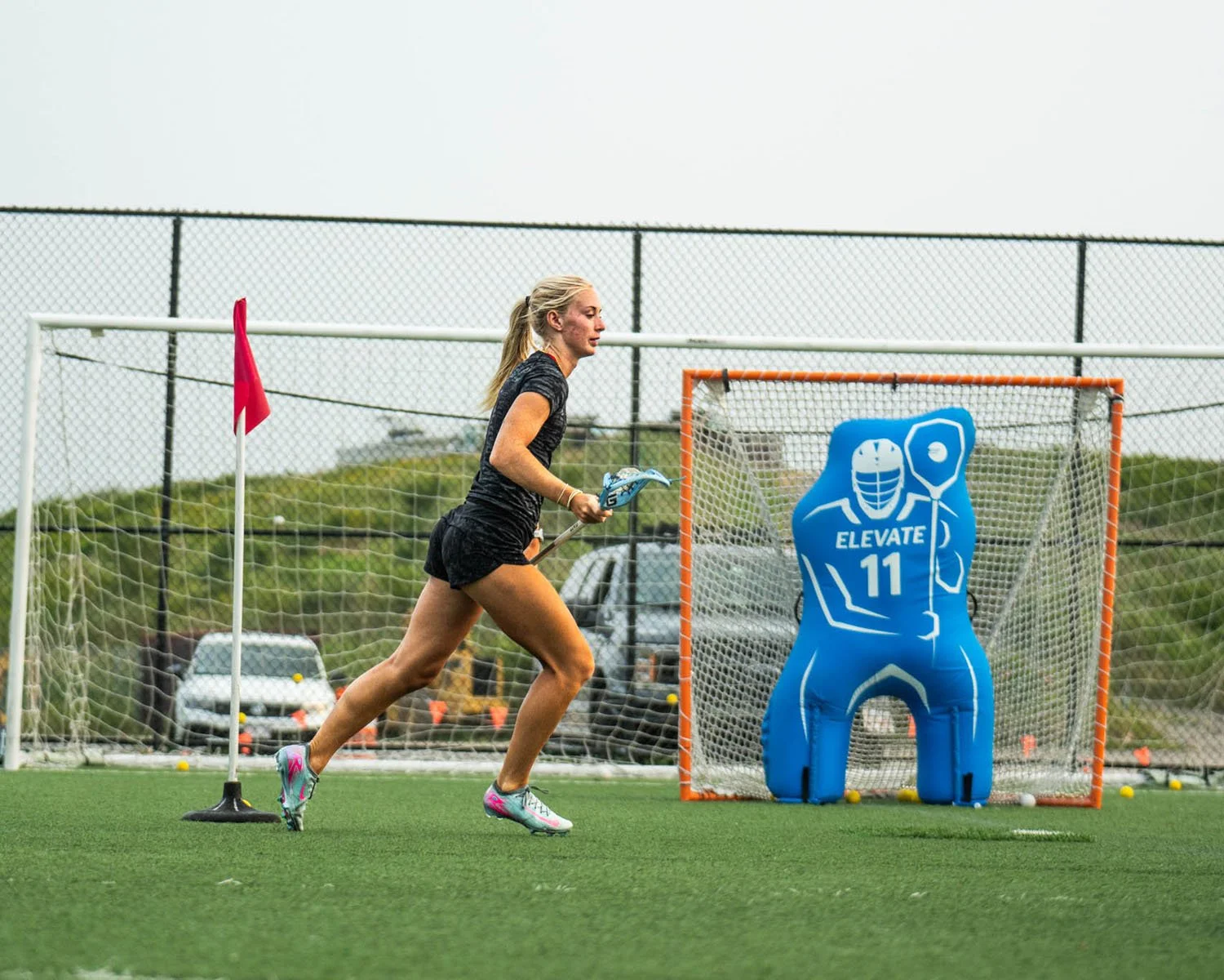 Girls lacrosse player sprinting around cone during shooting drill at Big Rock Lacrosse.jpg