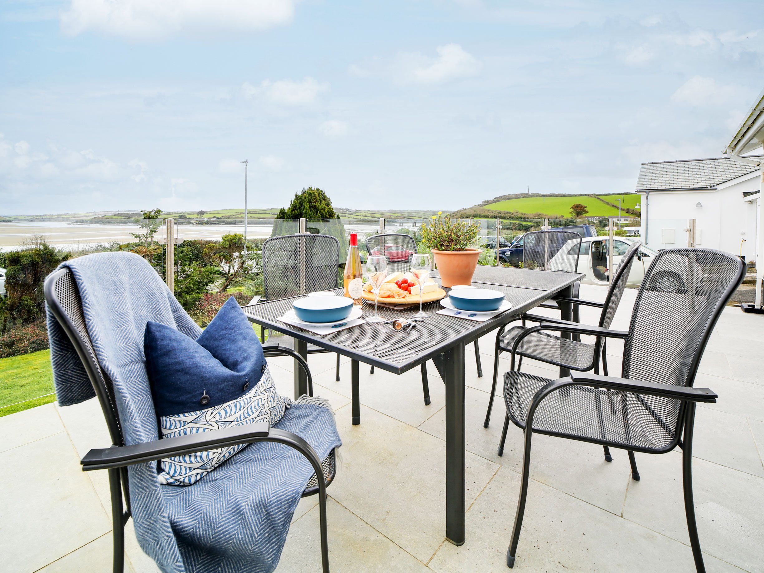 Inchmerry Padstow Self Catering Holiday Rental | Outdoor dining on the front patio overlooking the Camel Estuary