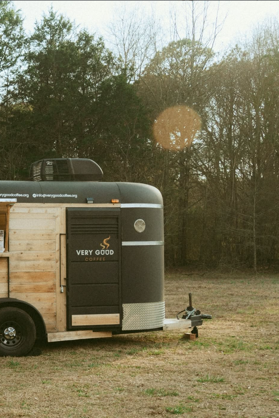 A beautiful mobile espresso bar inside a renovated horse trailer with natural wood and matte black finish serving weddings, gatherings, reunions and corporate events in and around Atlanta Georgia
