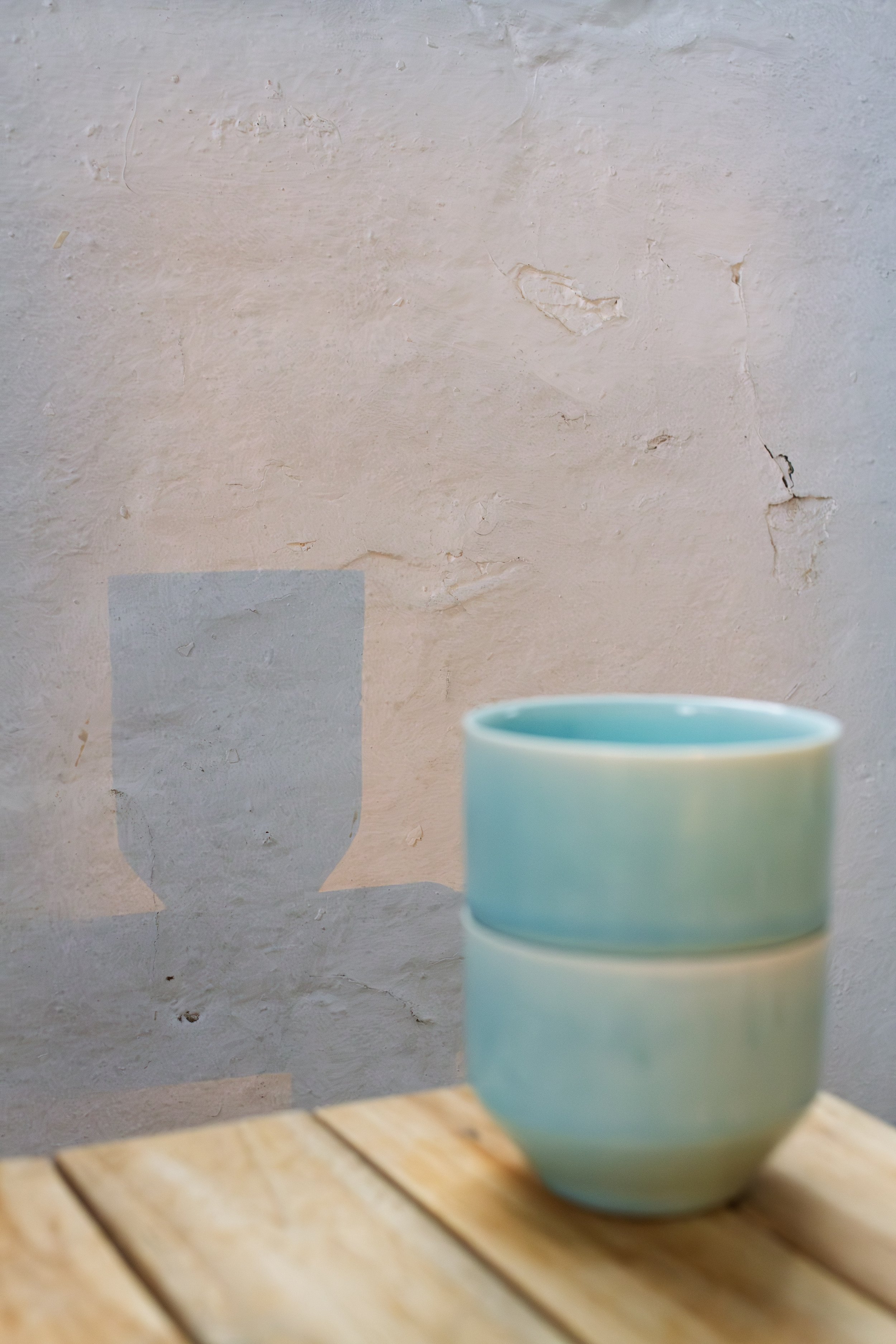 handmade porcelain stacking coffee cup yunomi in green blue glaze