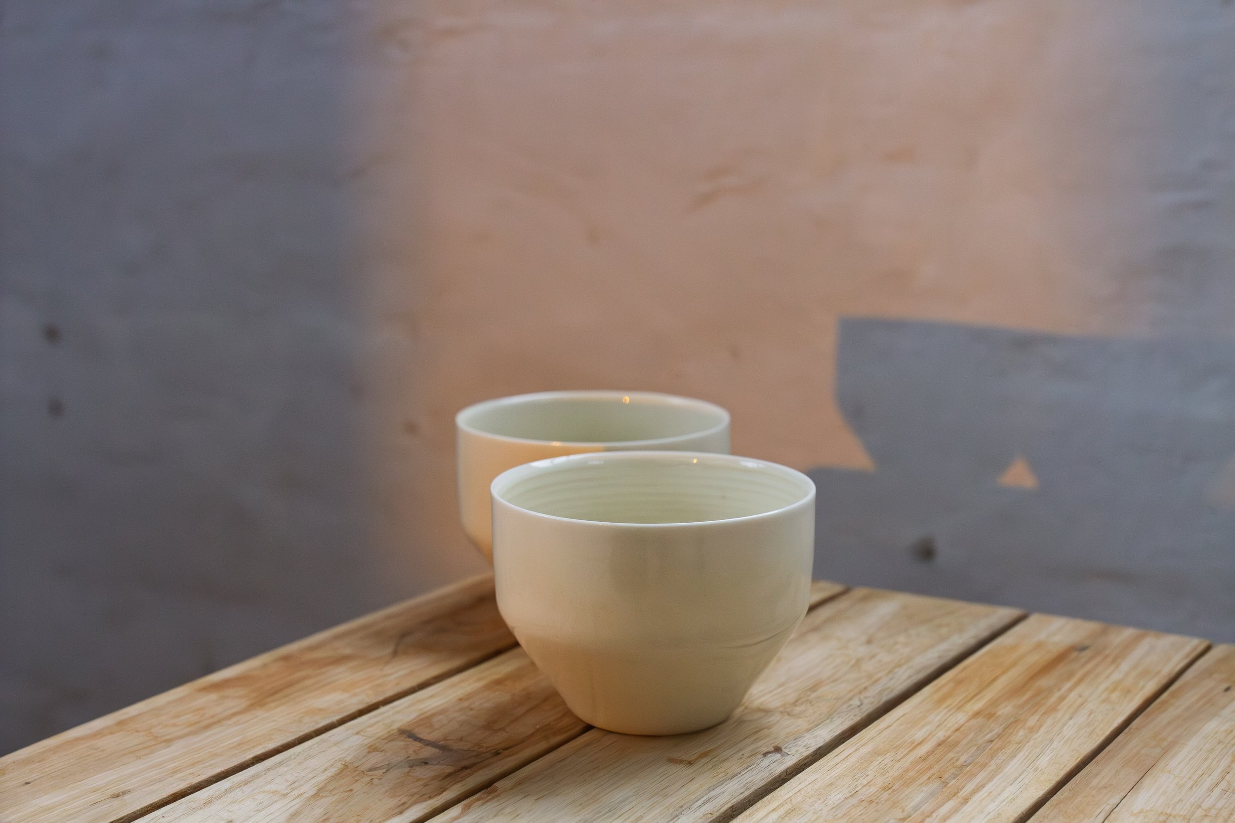 handmade porcelain coffee cup in pinkish white pearl glaze
