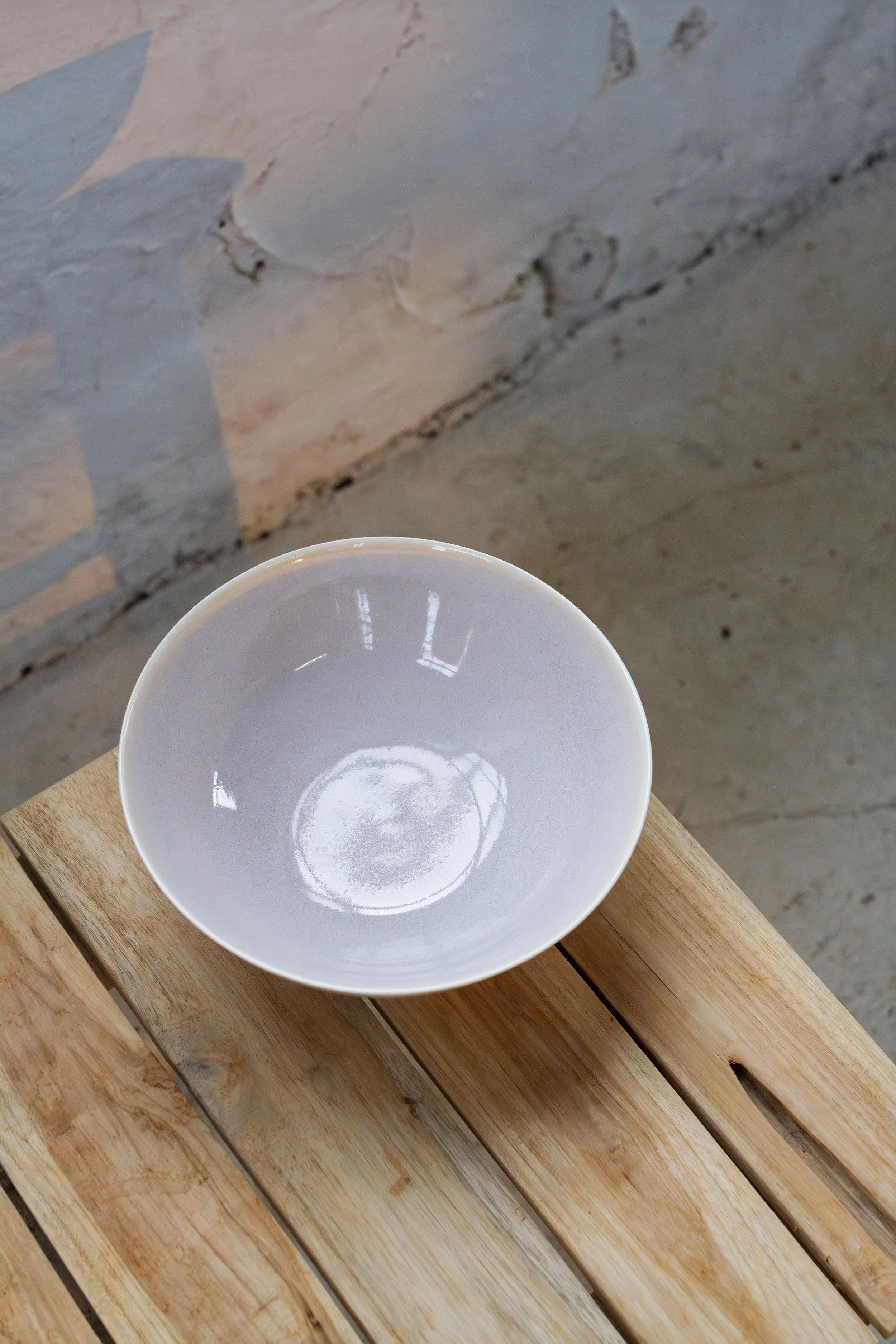 handmade porcelain wide low bowl in pastel lilac glaze made in stockport, manchester