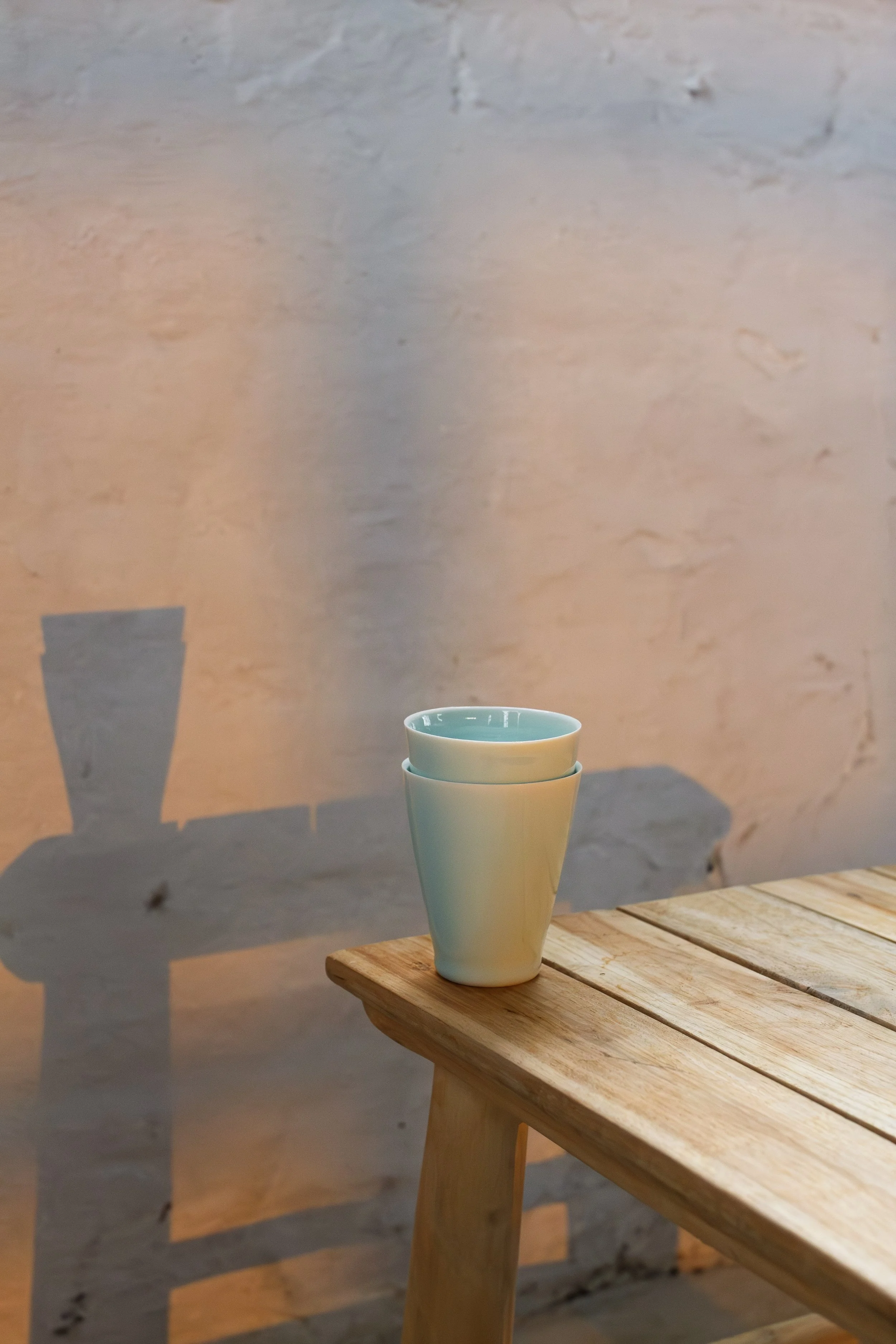 handmade porcelain Japanese sake cup in blue green siren glaze made in stockport, manchester