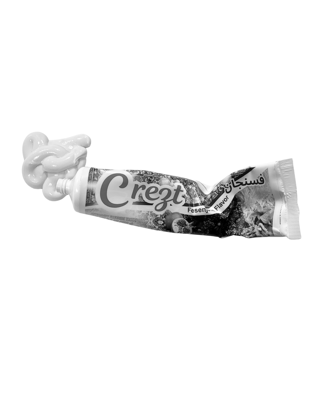 A tube of Fesenjoon flavoured  paste with some of the paste squeezed out, forming a loop on top of the tube.