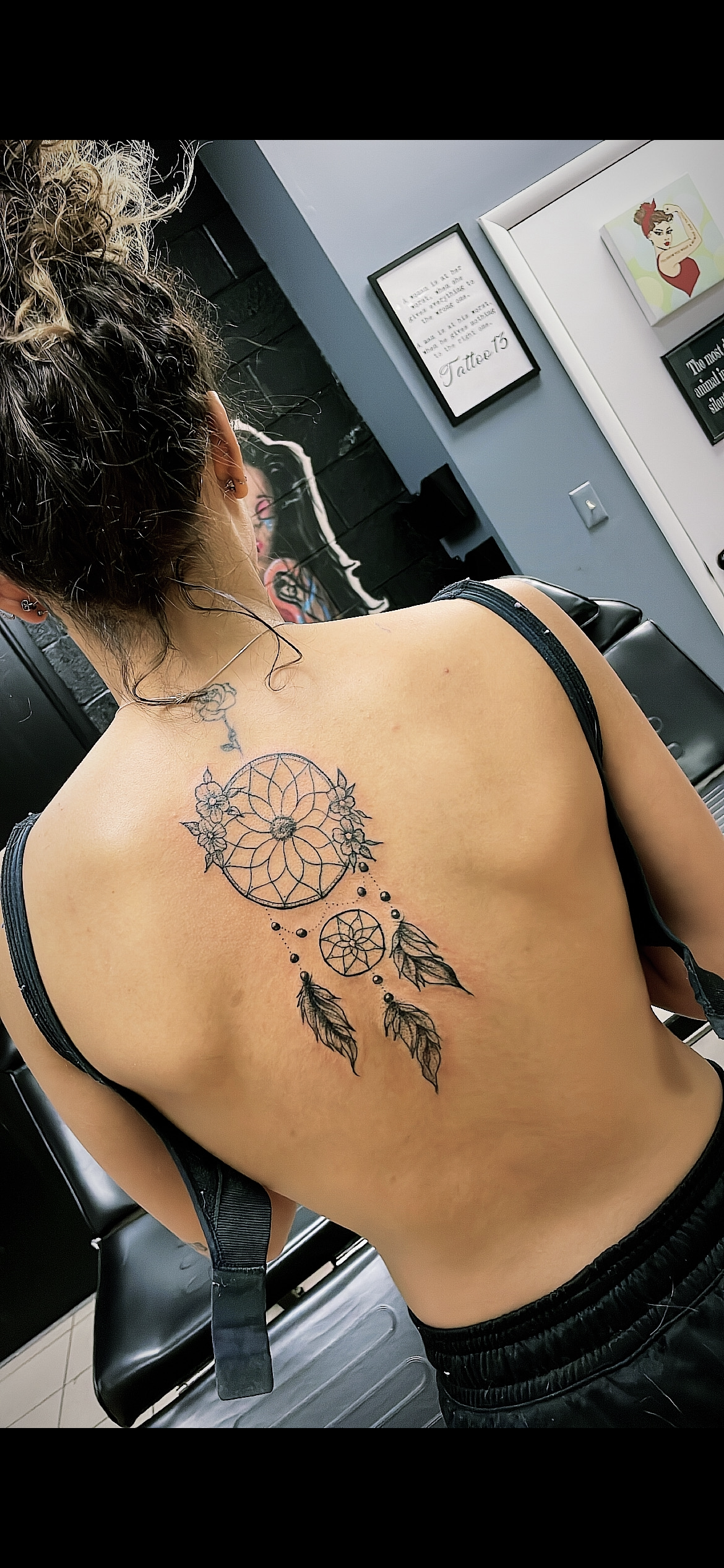 Woman with dreamcatcher tattoo on back