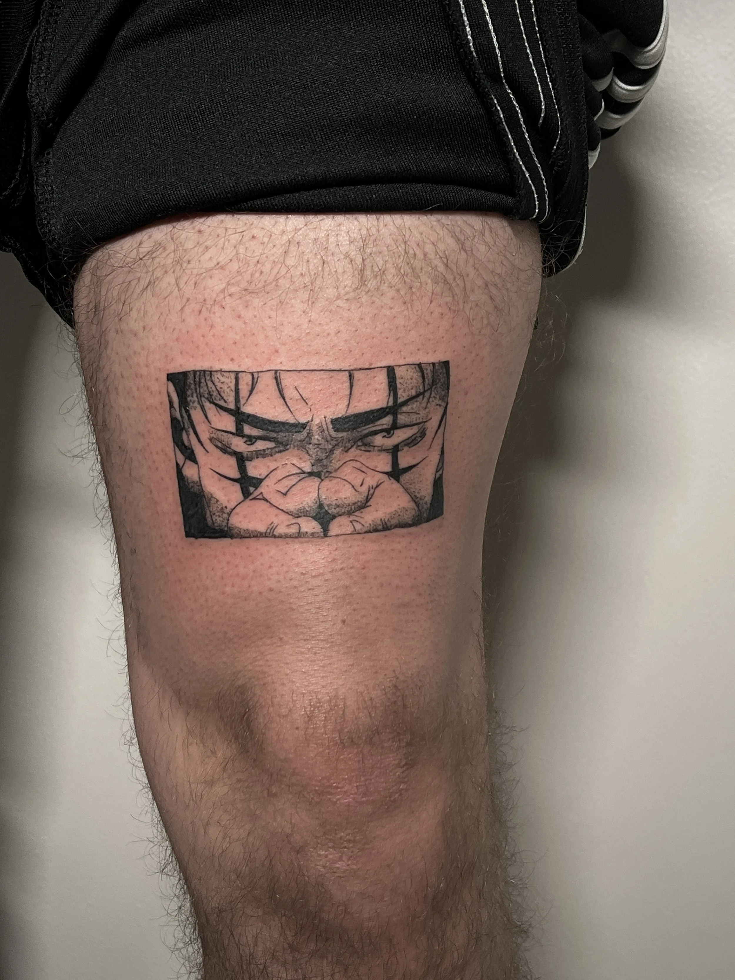 Close-up of a person's upper thigh with a tattoo of Choso, a character from the manga and anime Jujutsu Kaisen.