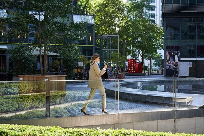 silhouette-corporate-woman-suit-walking-along-city-center-near-office-buildings.jpg
