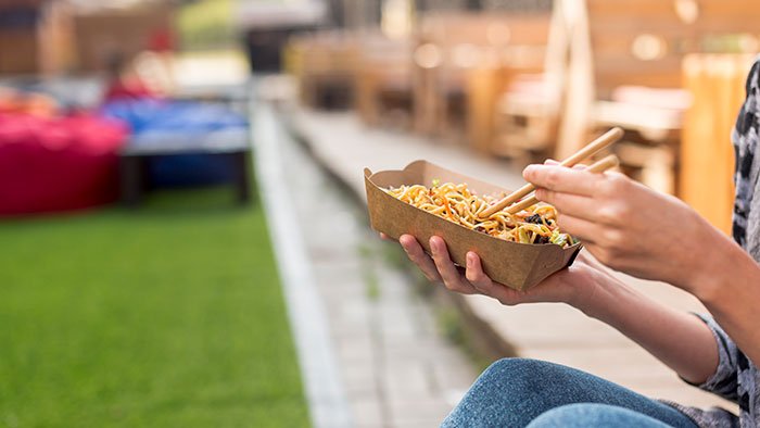 holding-chinese-food-with-blurred-background.jpg