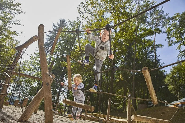 happy-kids-playing-wooden-playground-daytime-(1).jpg