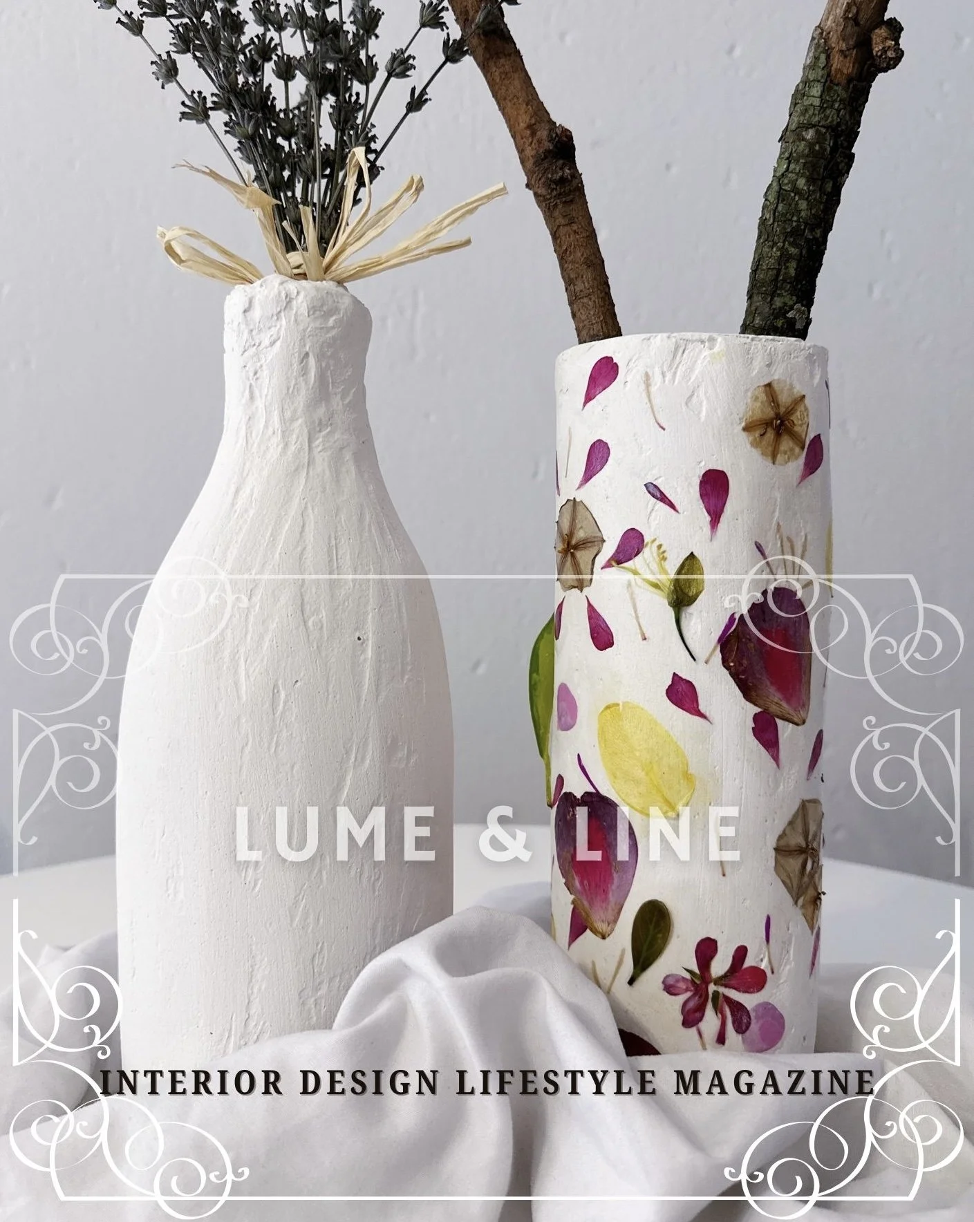 Two decorative vases with dried flowers, one plain white with a rustic tie and the other with a floral pattern, Lume & Line Interior Design Lifestyle Magazine text overlay.