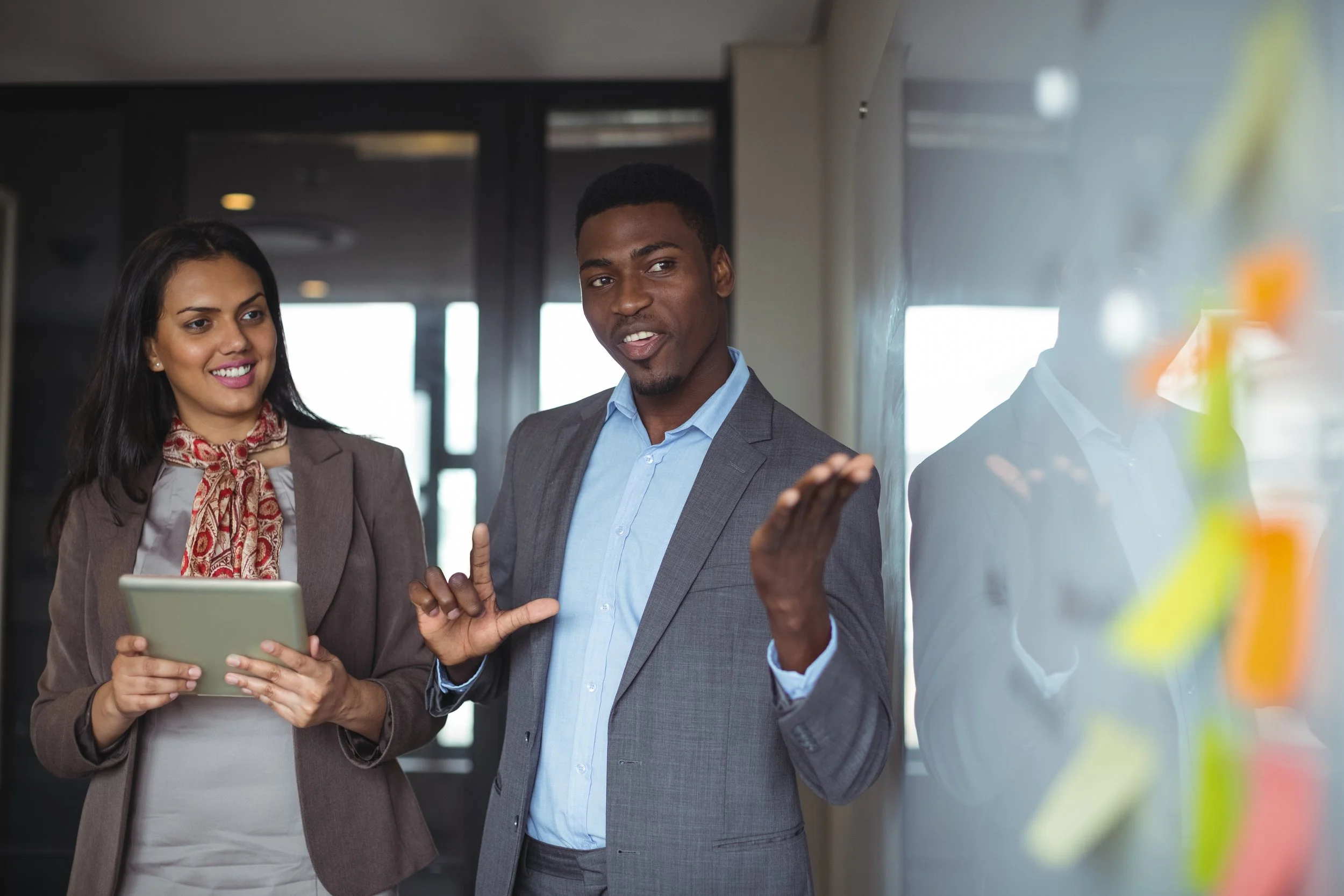 businessman-discussing-white-board-with-colleague.jpg