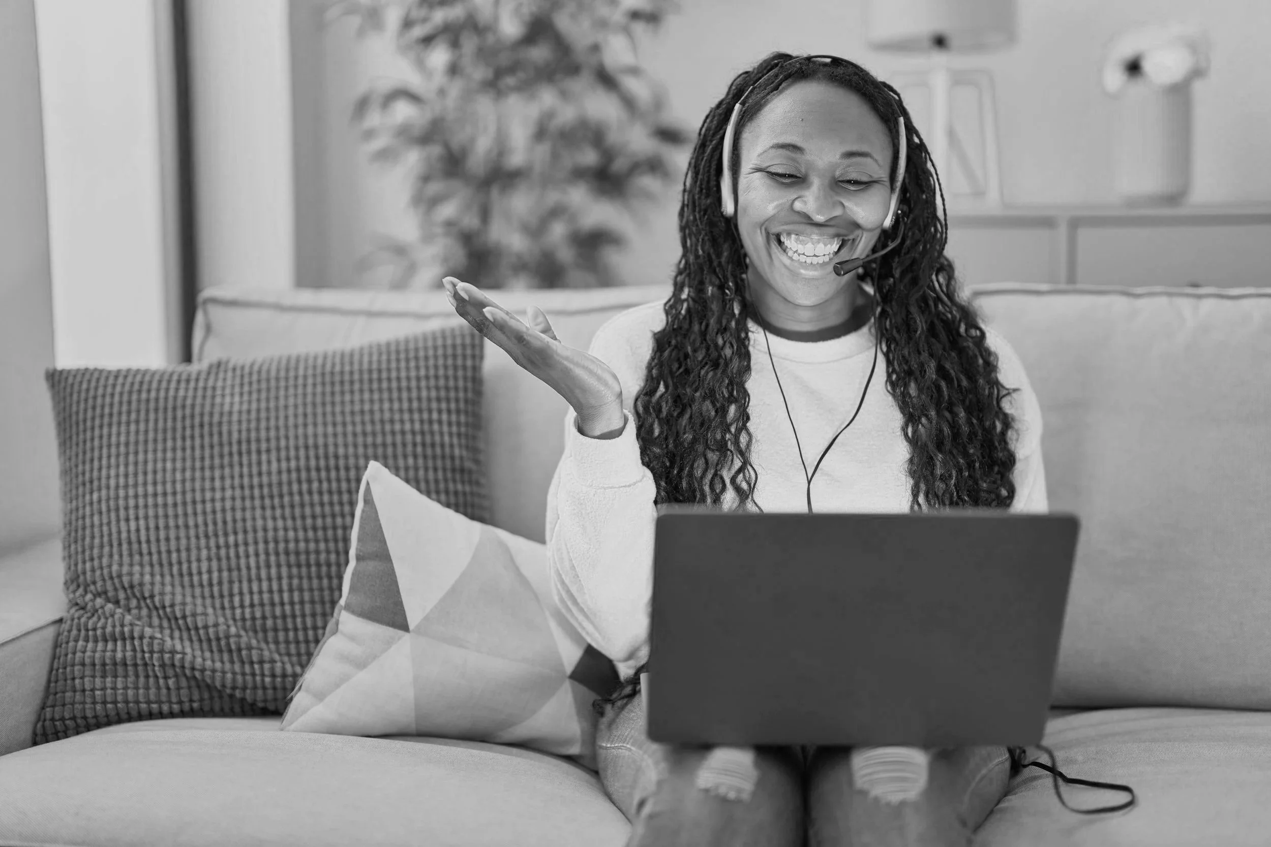 african-woman-working-home-wearing-operator-headset-celebrating-achievement-with-happy-smile-winner-expression-with-raised-hand.jpg (Copy)