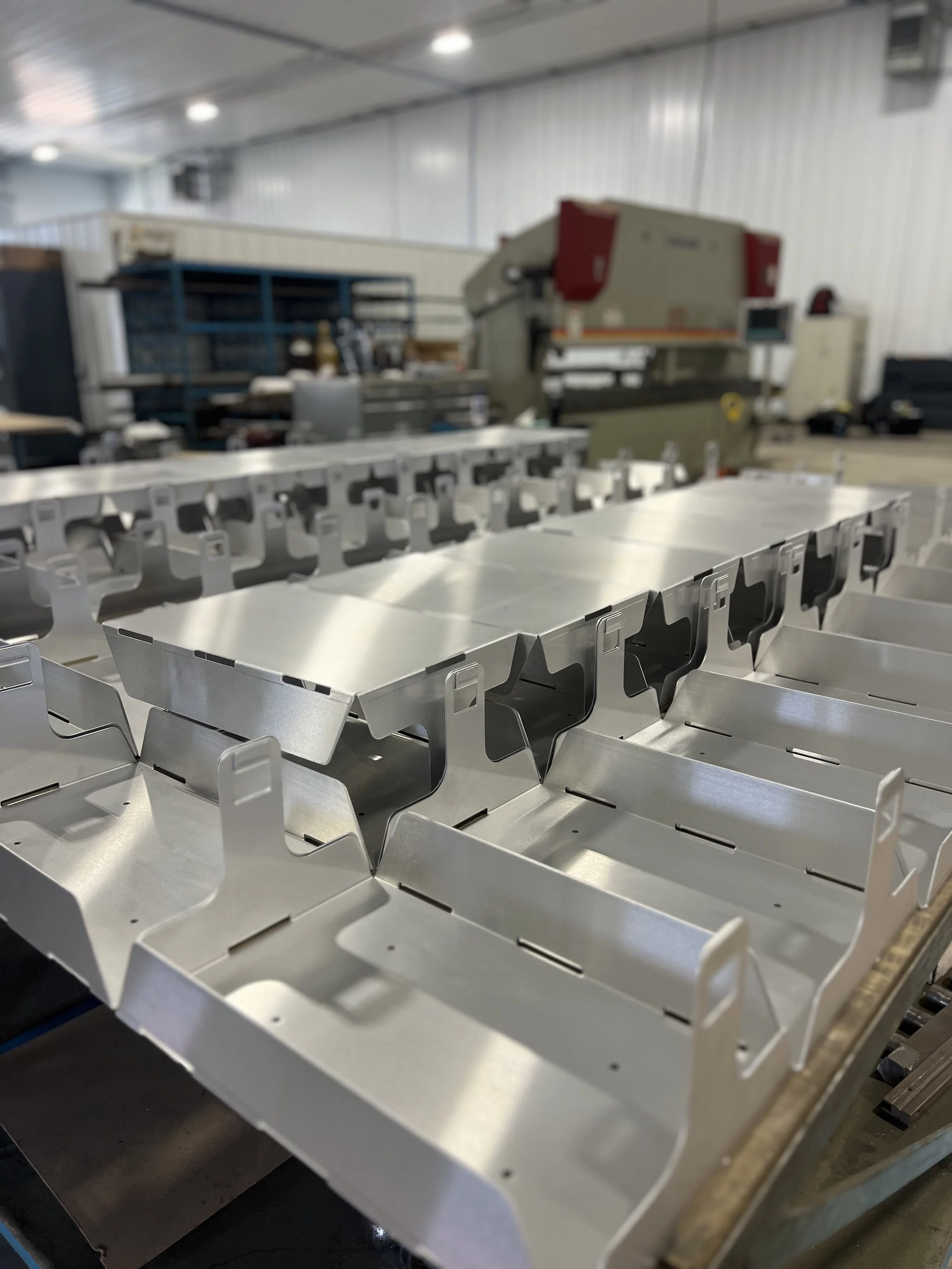 Laser-cut and formed stainless steel production trays manufactured by Fine-Line Fabrications