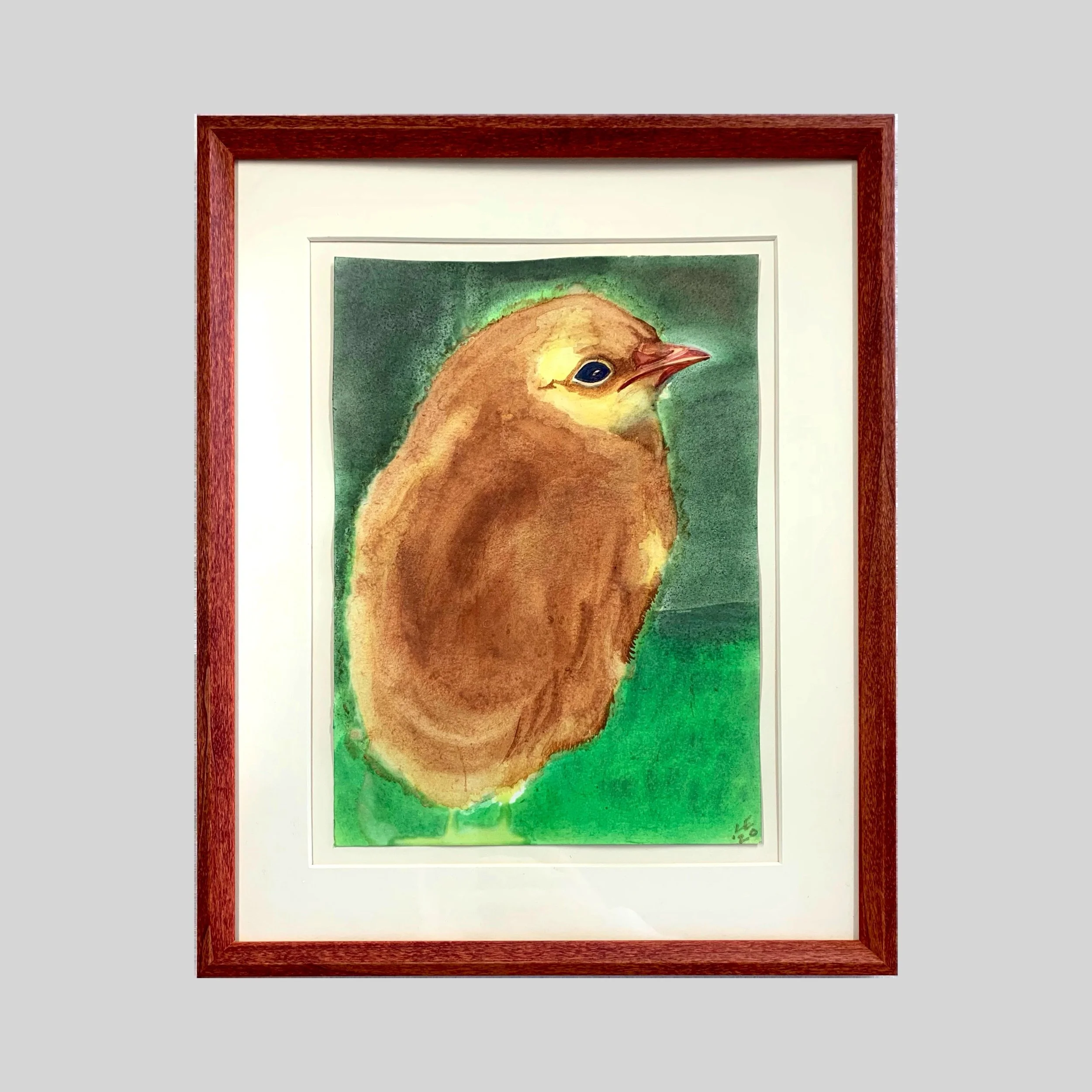 An original watercolor painting of a baby chick framed in a dainty, reddish-brown, hand-stained archival frame. 