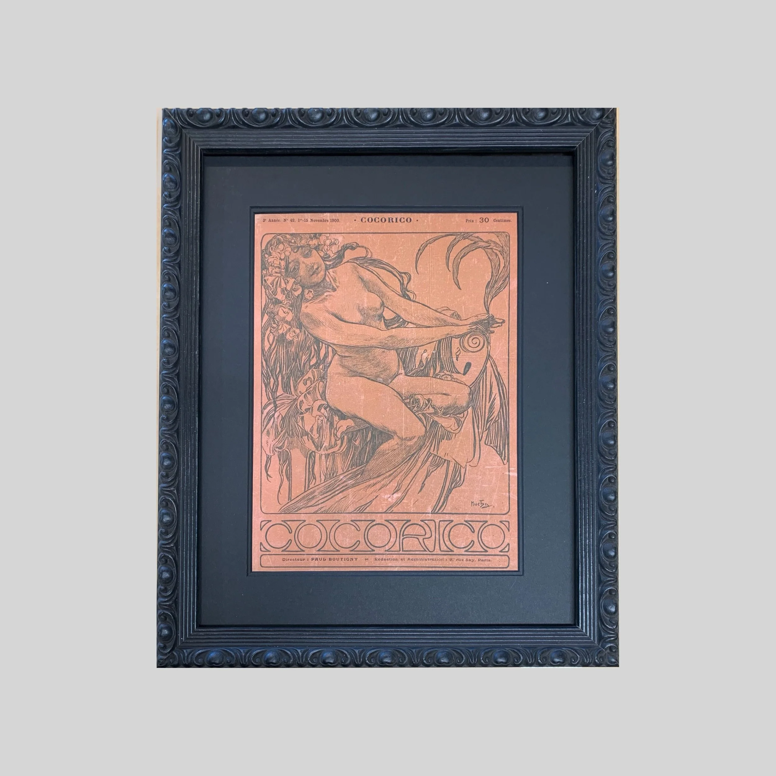 An original edition of the 19th century magazine "Cocorico"  featuring the cover illustration by Alphonse Mucha in an ornate black Italian frame. 