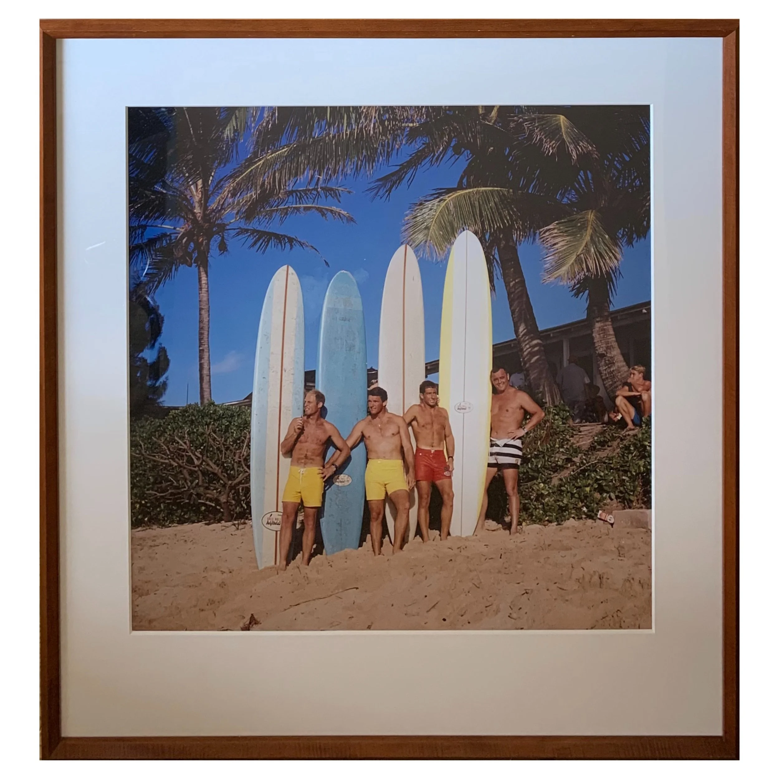 An original photograph featuring a scene of mid-twentieth century Hawaiian surfers in a hand-crafted koa wood frame.