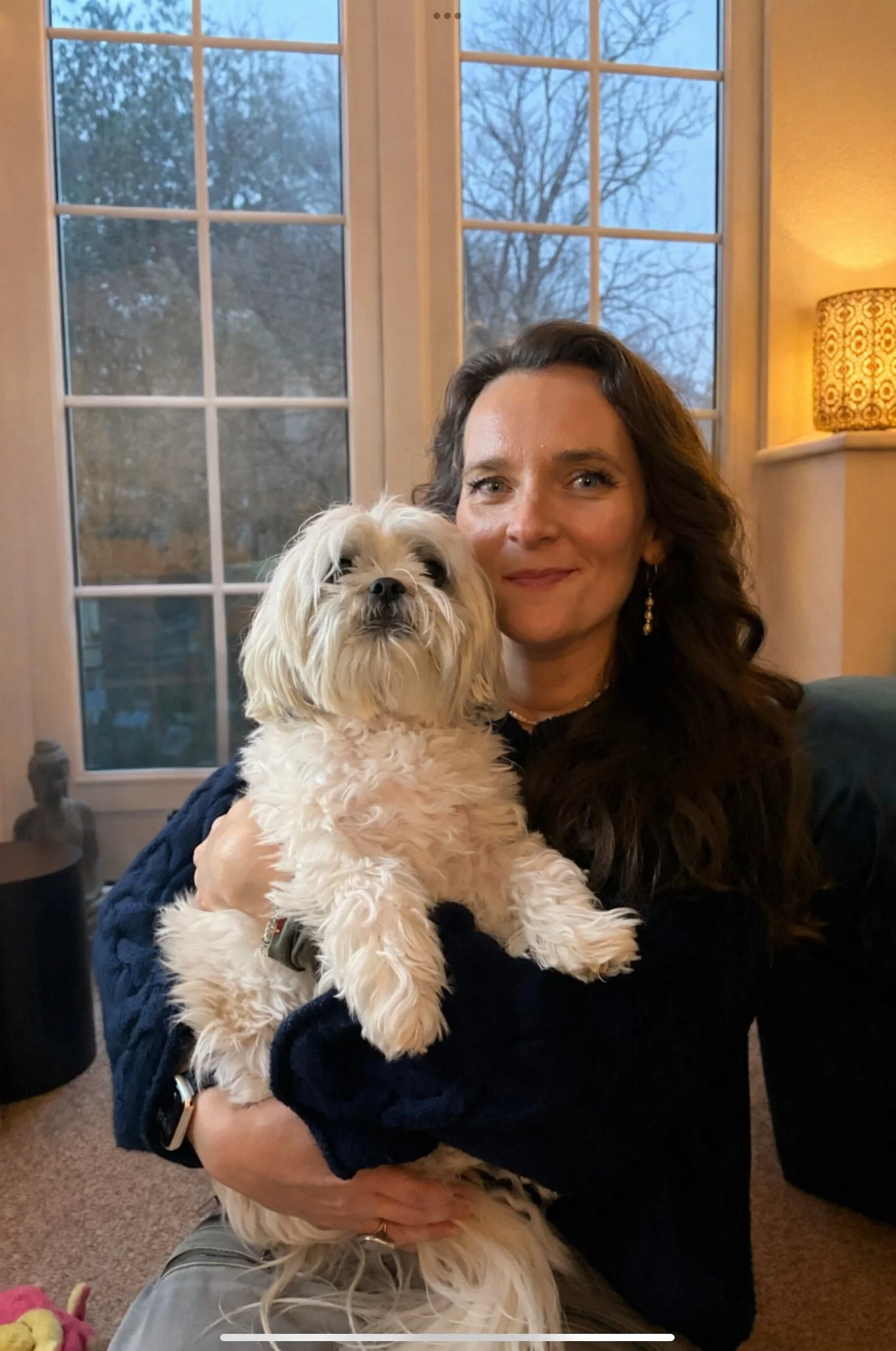 Laura Perry holding her Shih Tzu, Lottie.