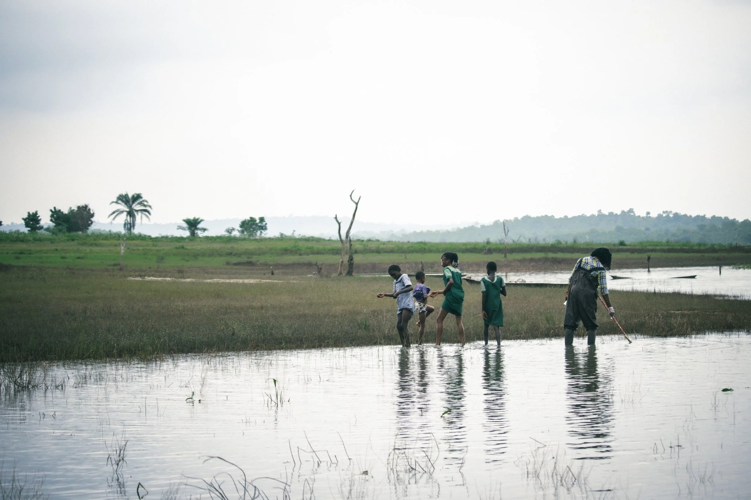 Dr. Olubukola conducting vegetation sampling  to identify preferred habitats of host snails where schistosomiasis will pose a higher risk of transmission