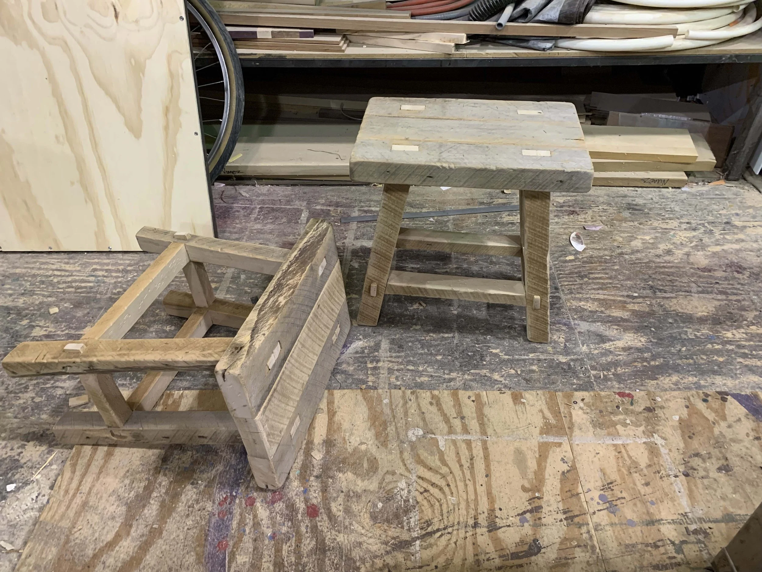 Two matching rustic stools built or a production of A.D. 16 (Olney Theater Center).