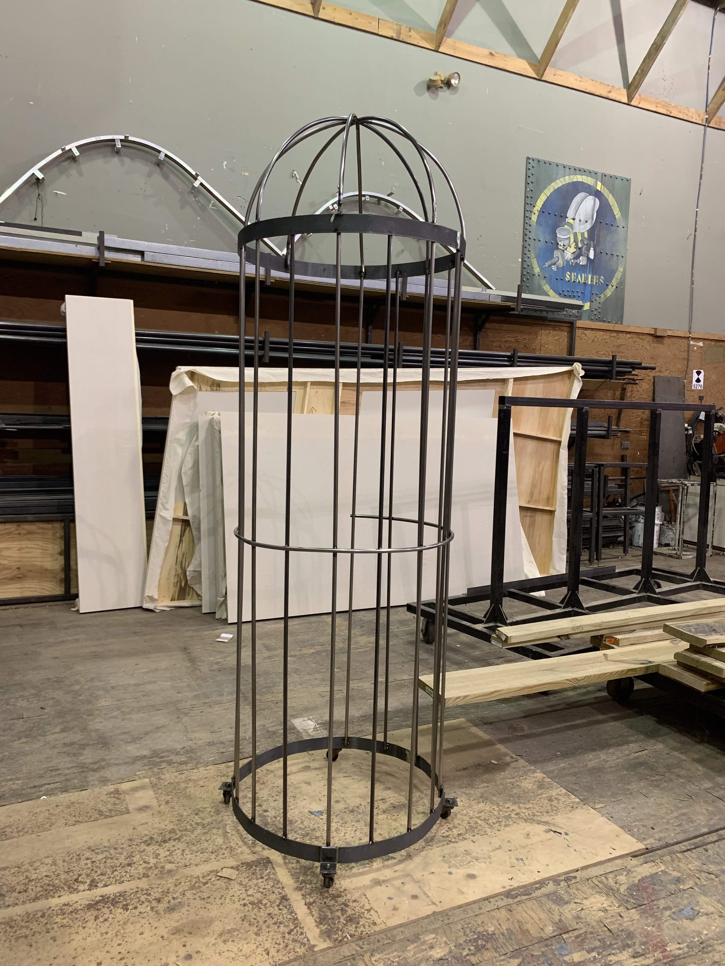 A human-sized cage built out steel tube and strap for a production of Beauty and the Beast (Olney Theater Center).