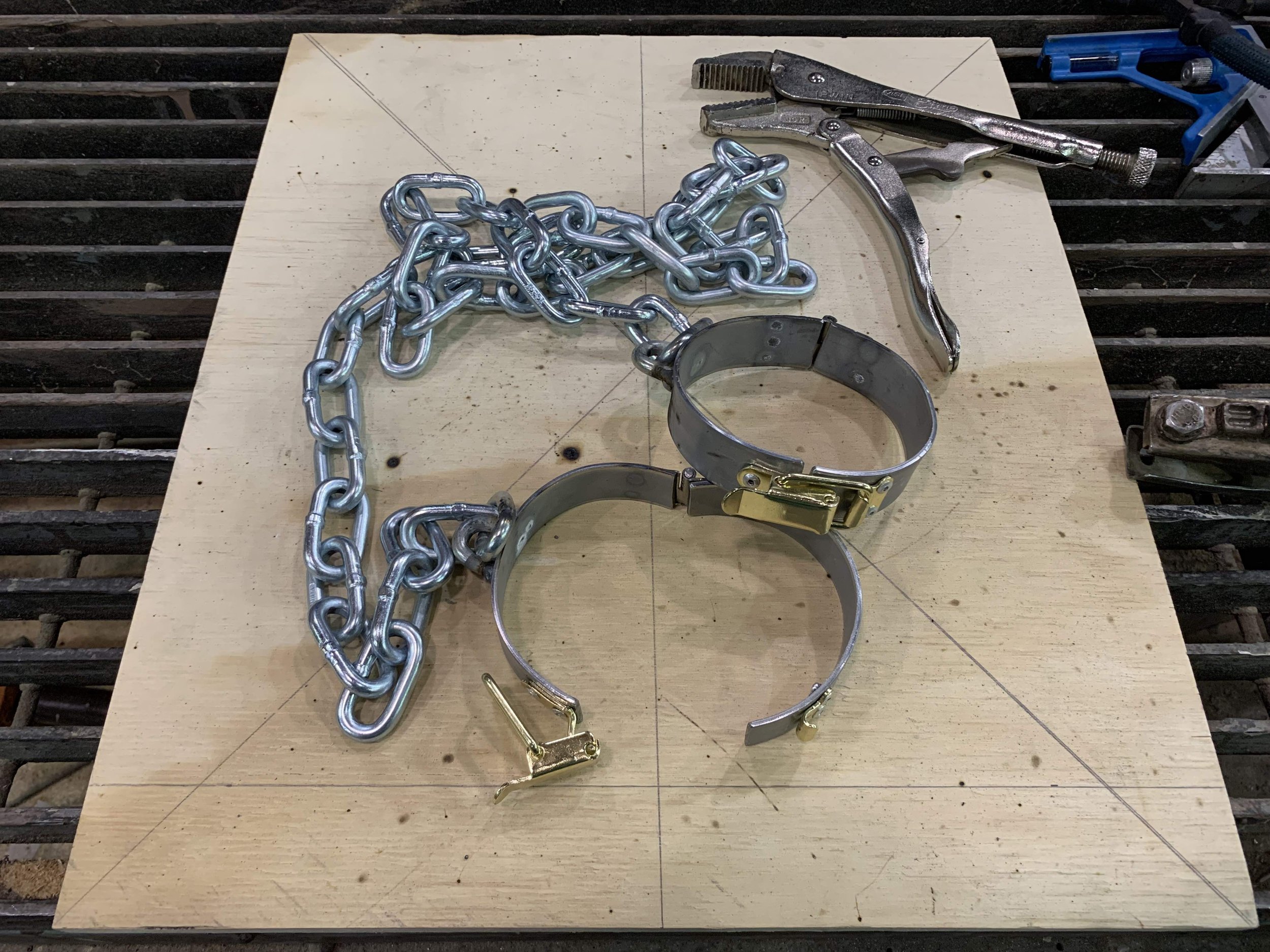 A pair of oversized steel shackles used in a production of A.D. 16 (Olney Theater Center).