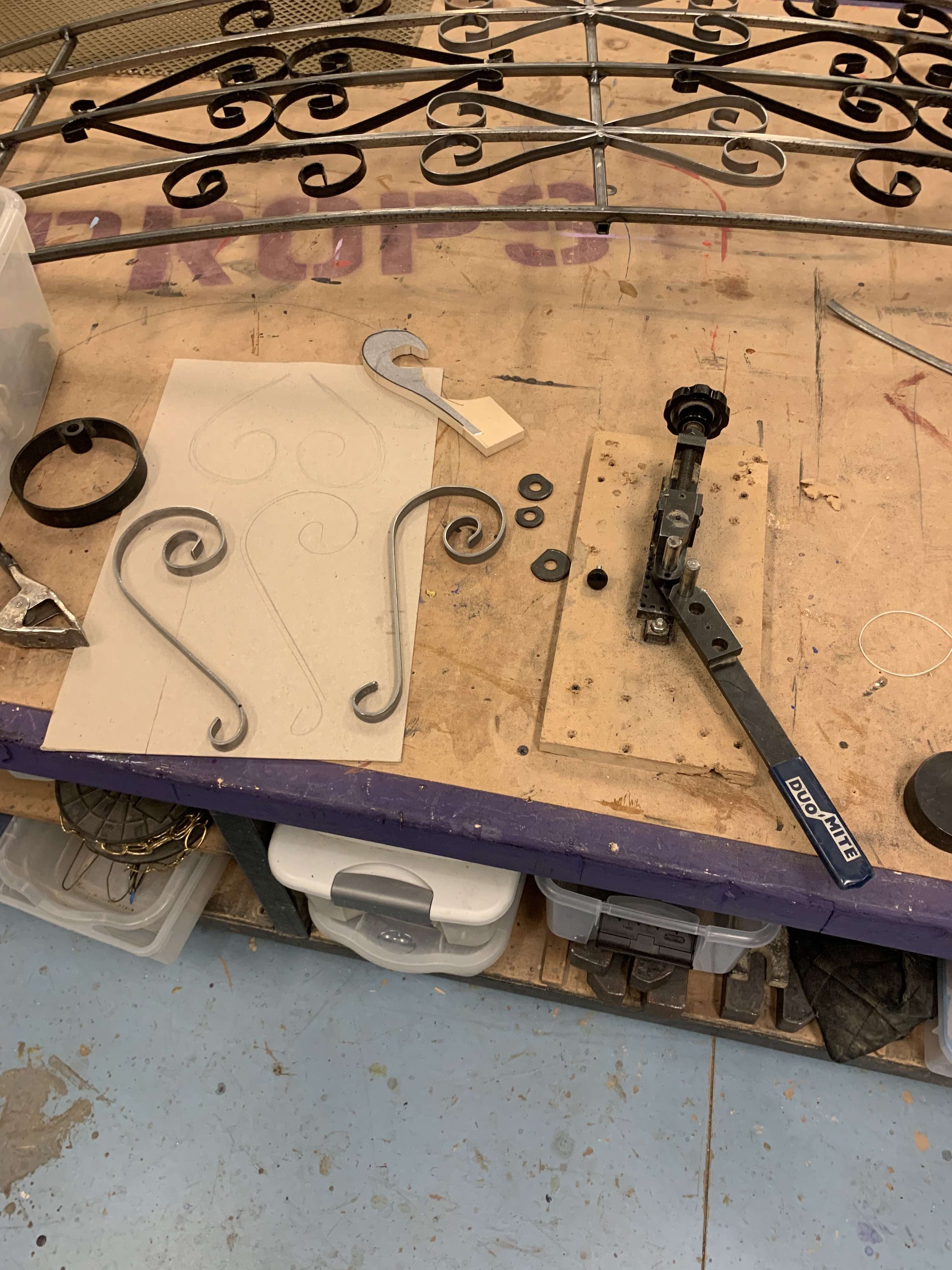 Using a bench top bender, I turned 1" steel strap into spiral shaped details for a steel gate used in a production of A Bicycle Country (UMD).