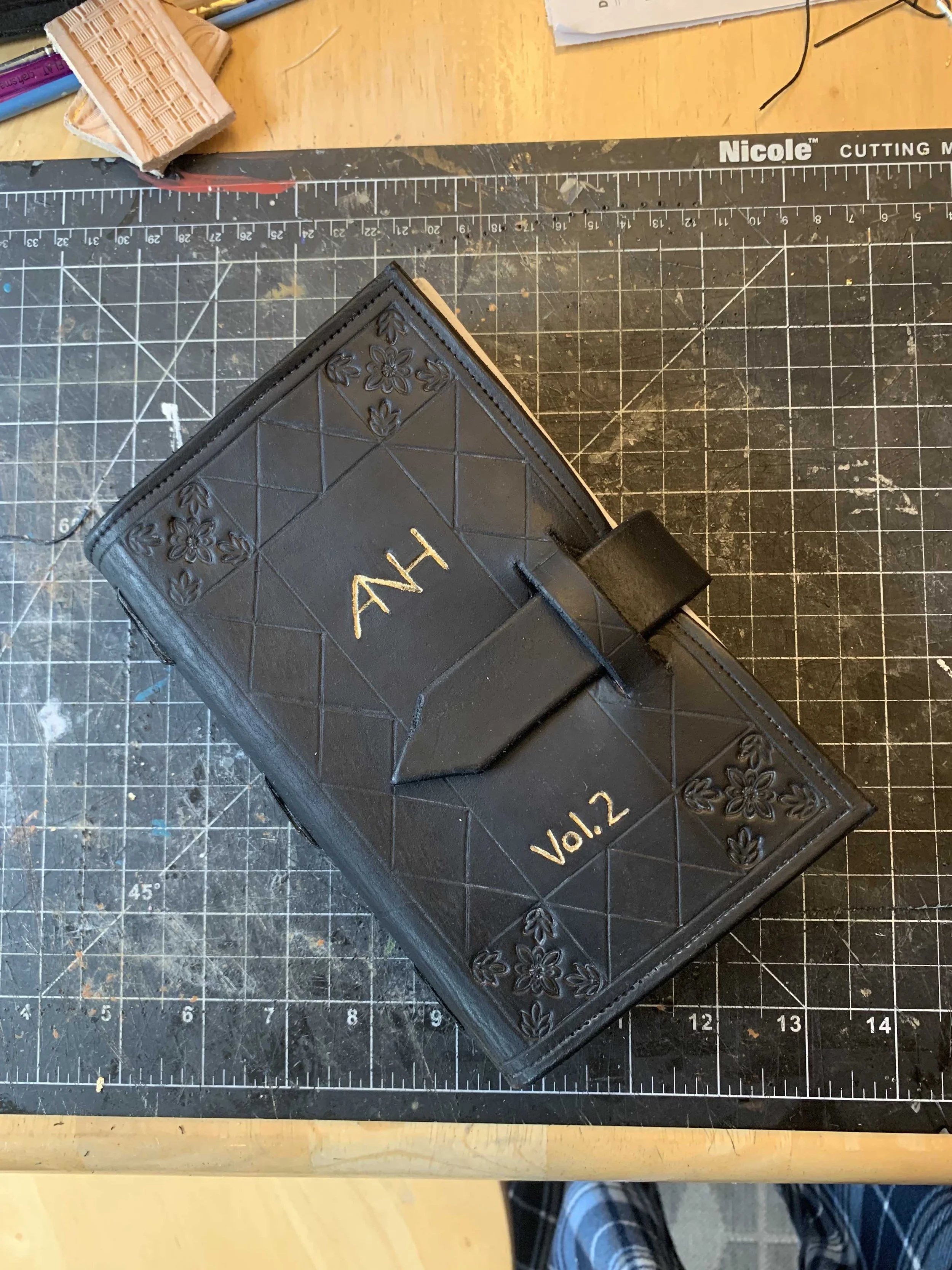 An early hand bound book made of recycled paper and veg tanned leather. 